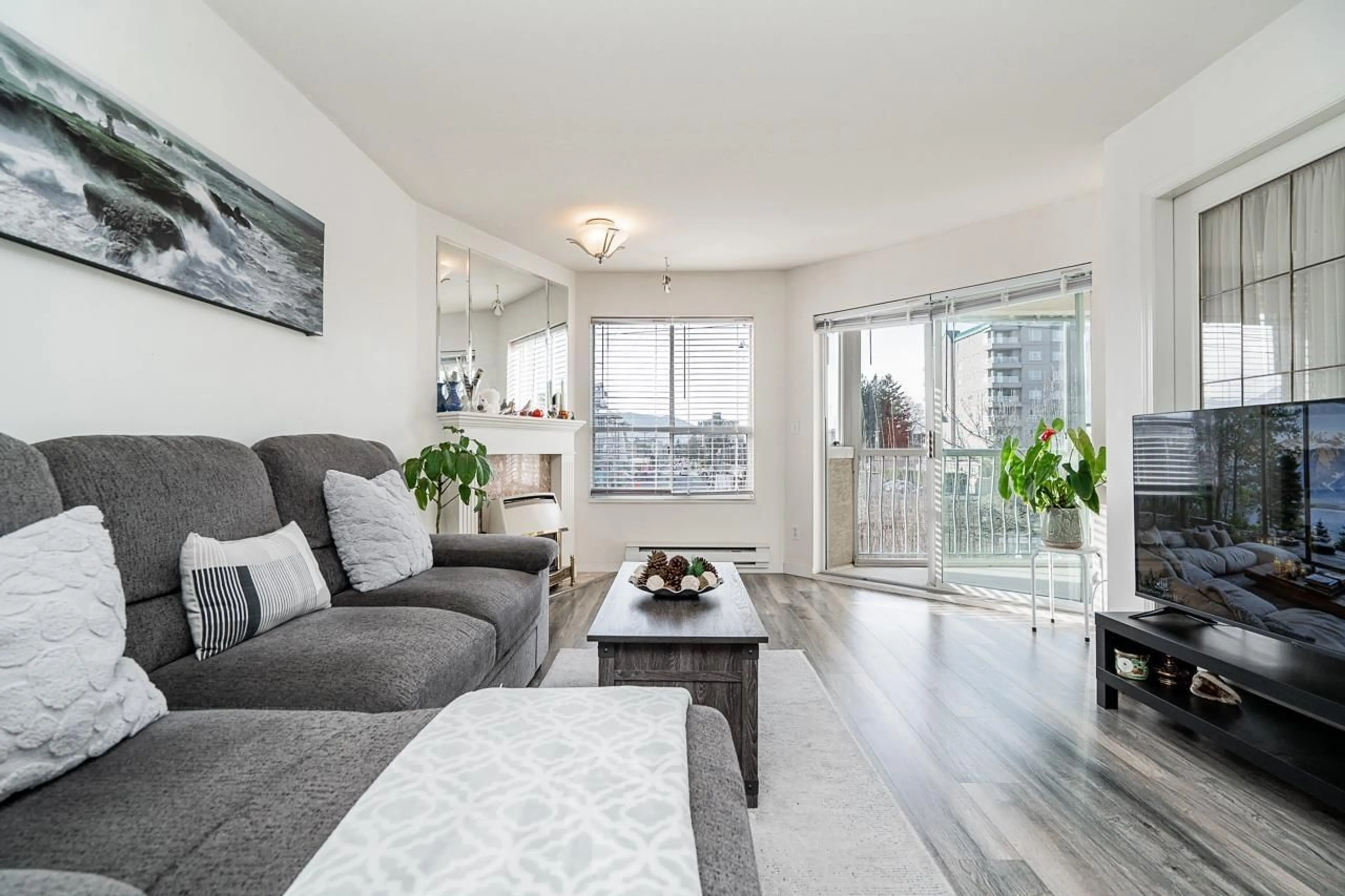 Living room with furniture, wood/laminate floor for 204 - 9400 COOK STREET, Chilliwack British Columbia V2P4J6