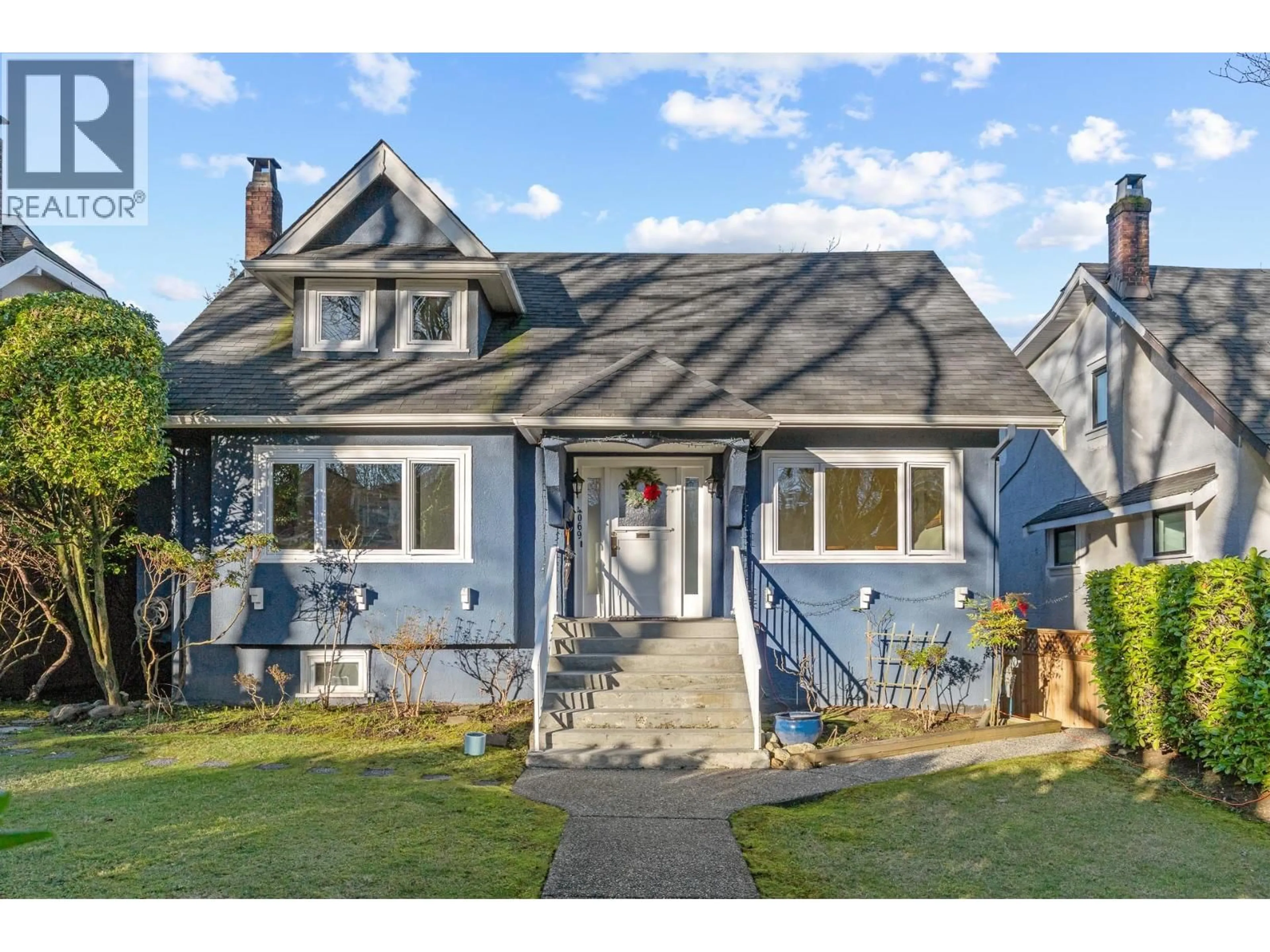 Home with vinyl exterior material, street for 4069 14TH AVENUE, Vancouver British Columbia V6R2X3