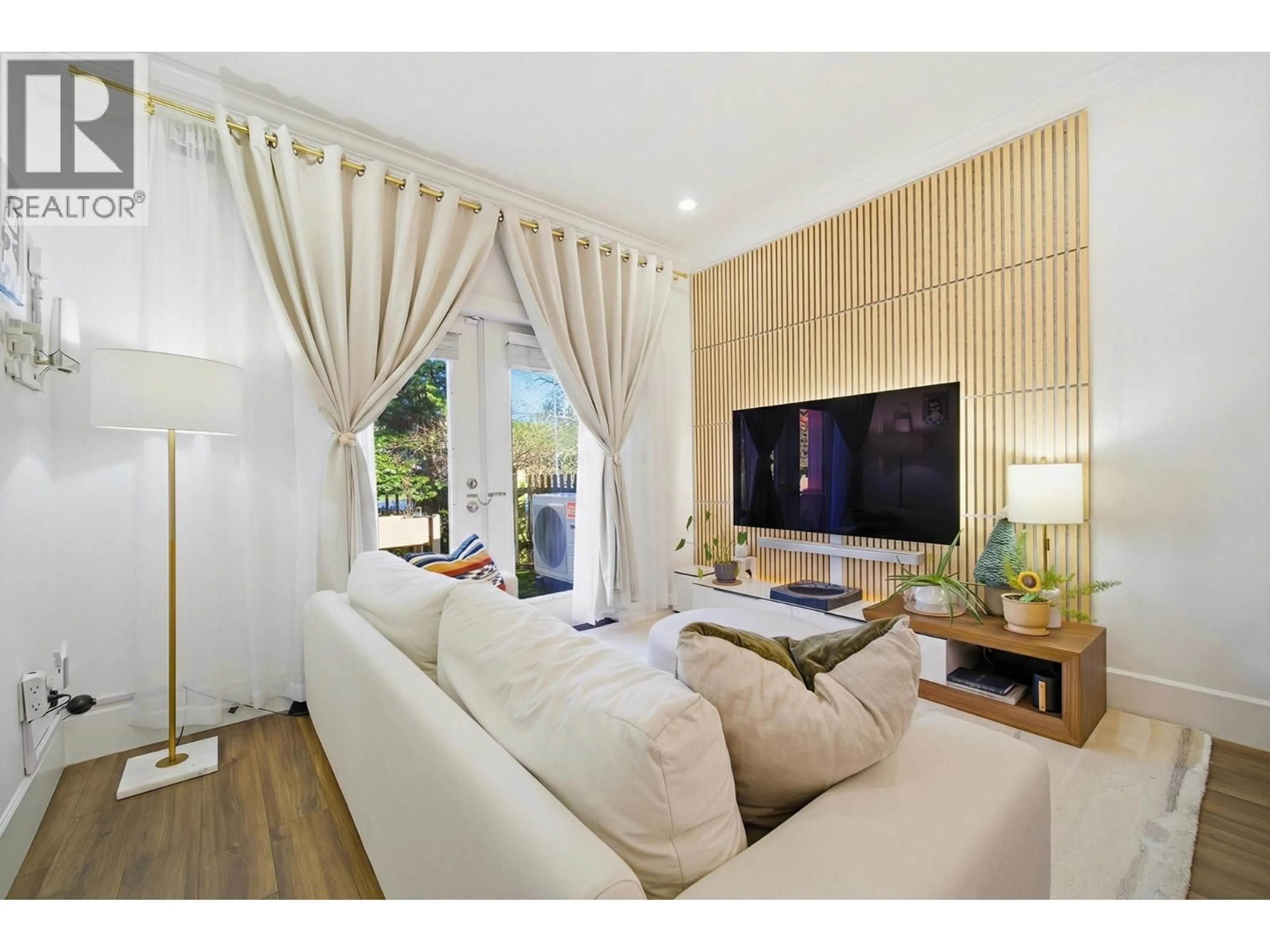 Living room with furniture, wood/laminate floor for 16 - 6331 NO. 4 ROAD, Richmond British Columbia V6Y2T1