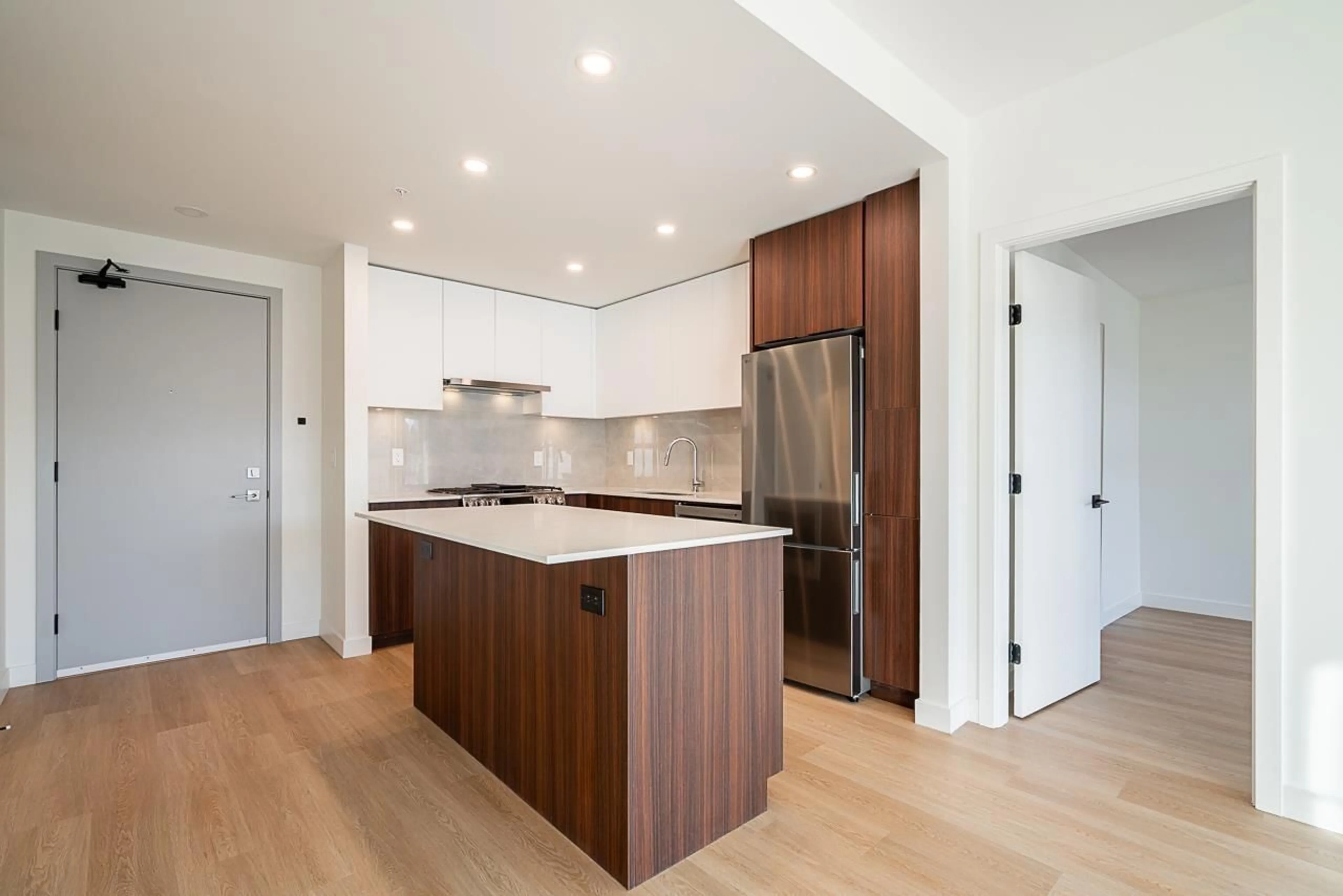 Open concept kitchen, wood/laminate floor for A317 - 7980 206A STREET, Langley British Columbia V2Y3Z8