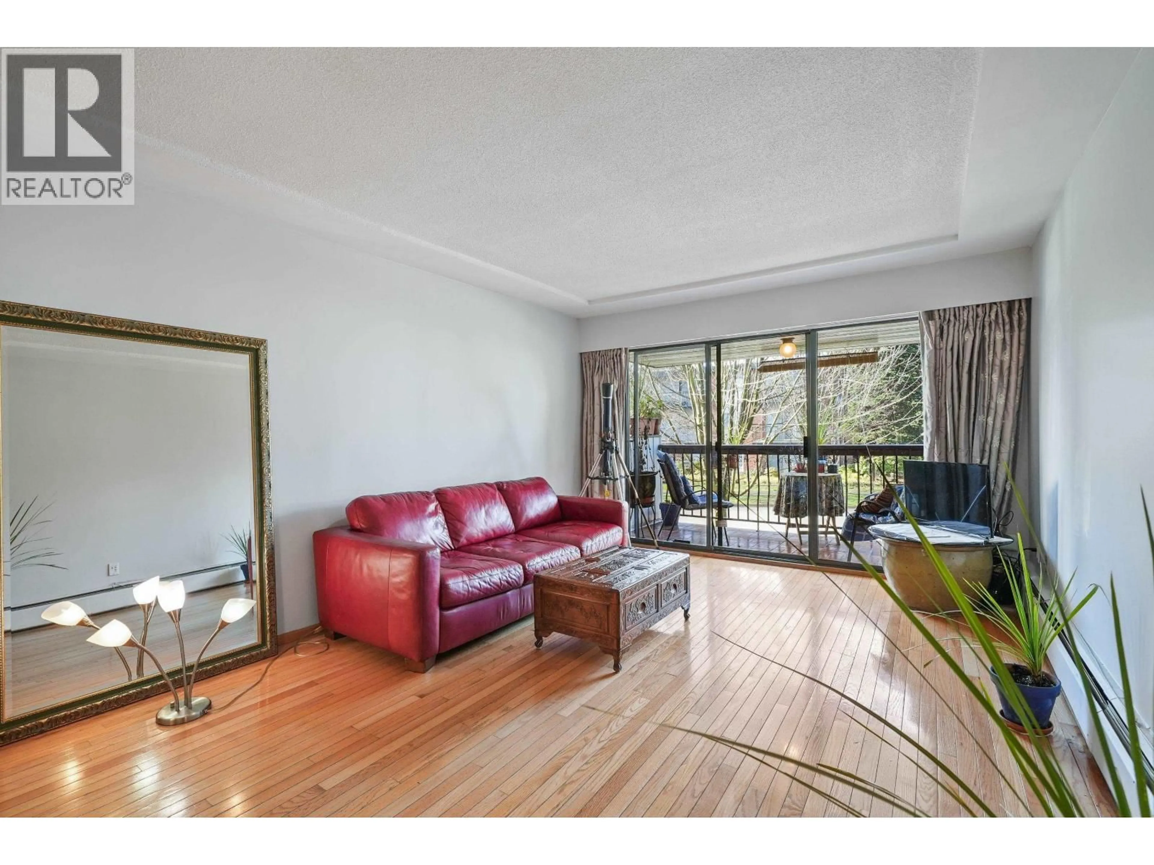 Living room with furniture, wood/laminate floor for 202 - 8770 LAUREL STREET, Vancouver British Columbia V6P3V6