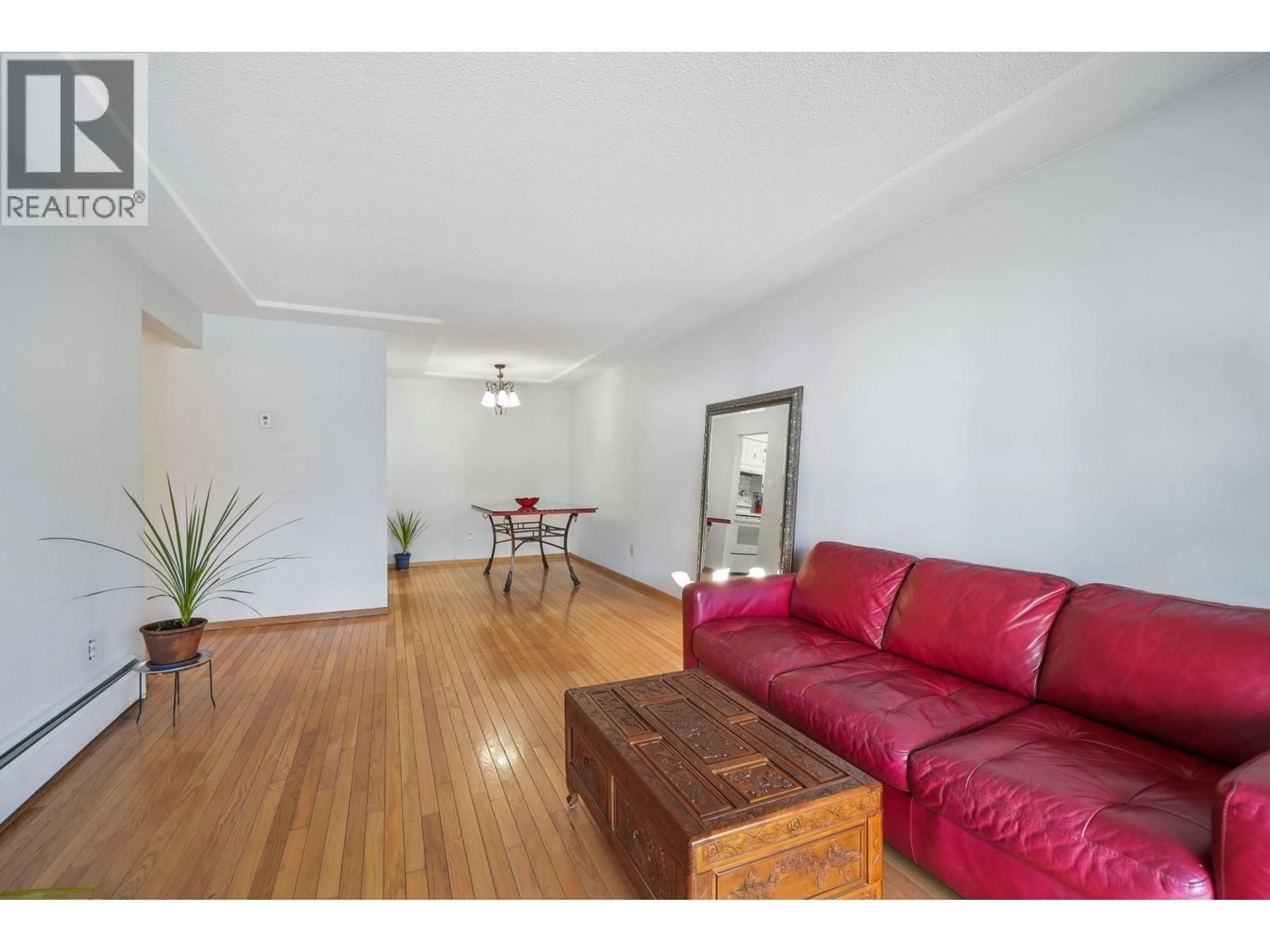 Living room with furniture, wood/laminate floor for 202 - 8770 LAUREL STREET, Vancouver British Columbia V6P3V6