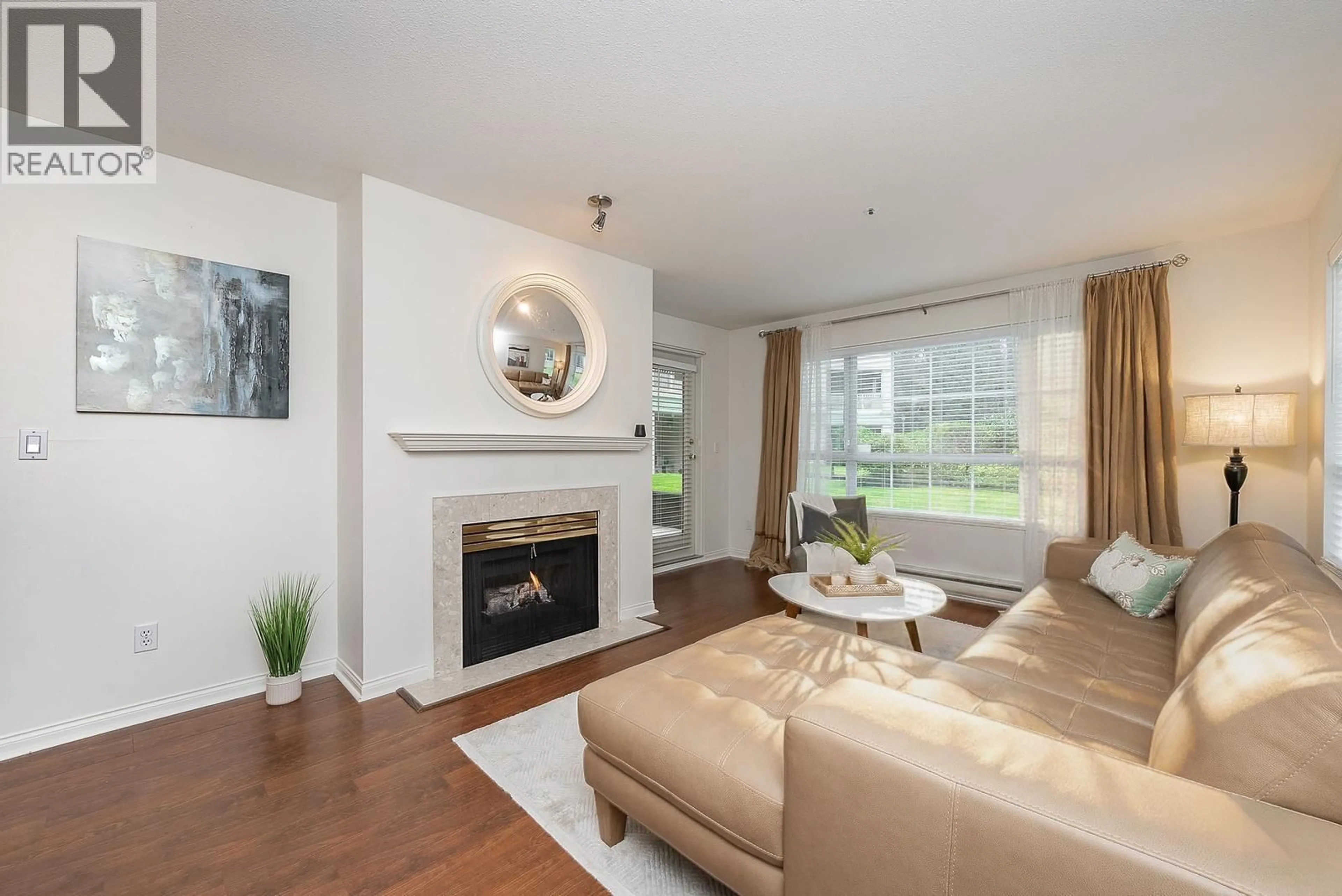 Living room with furniture, wood/laminate floor for 101 - 2975 PRINCESS CRESCENT, Coquitlam British Columbia V3B7N3