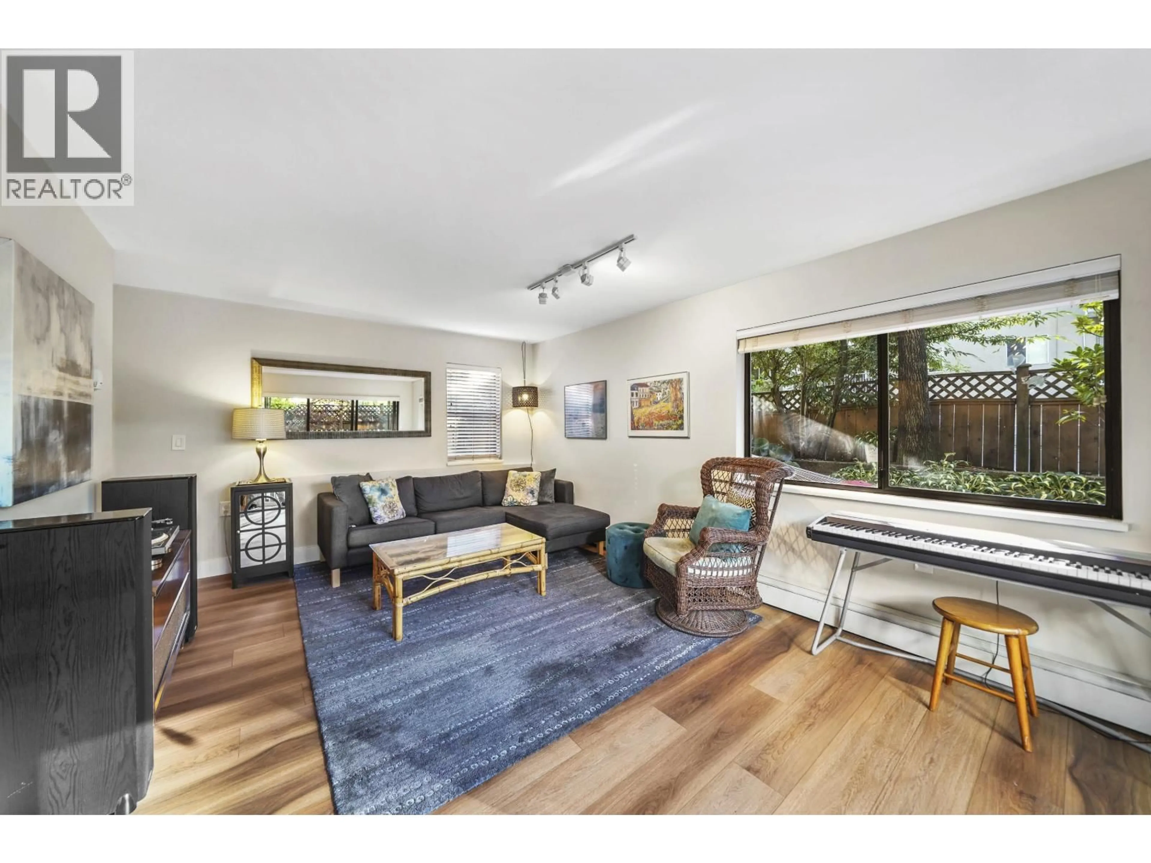 Living room with furniture, wood/laminate floor for 101 - 2935 SPRUCE STREET, Vancouver British Columbia V6H3N6