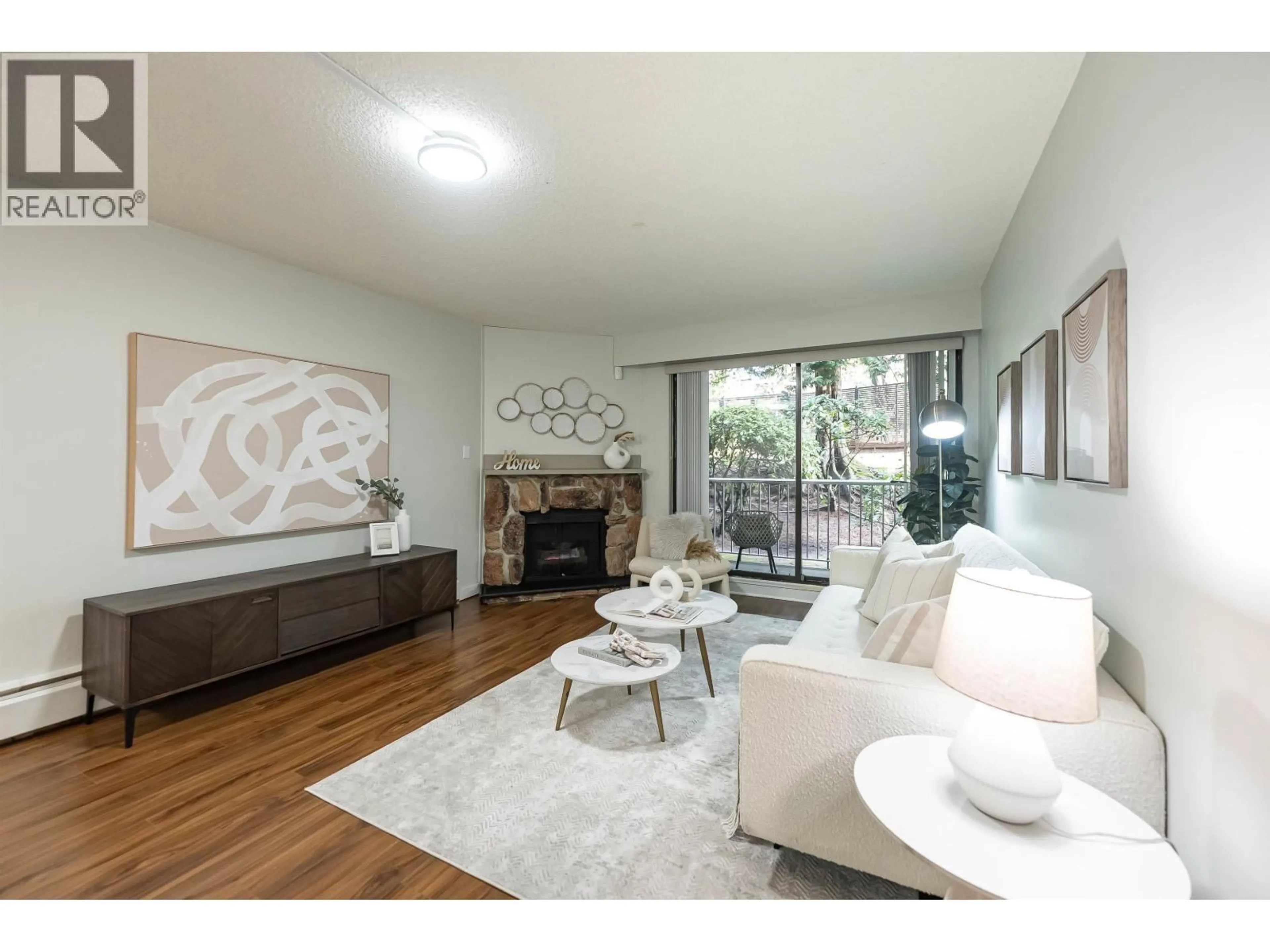 Living room with furniture, unknown for 102 - 3901 CARRIGAN COURT, Burnaby British Columbia V3N4K1