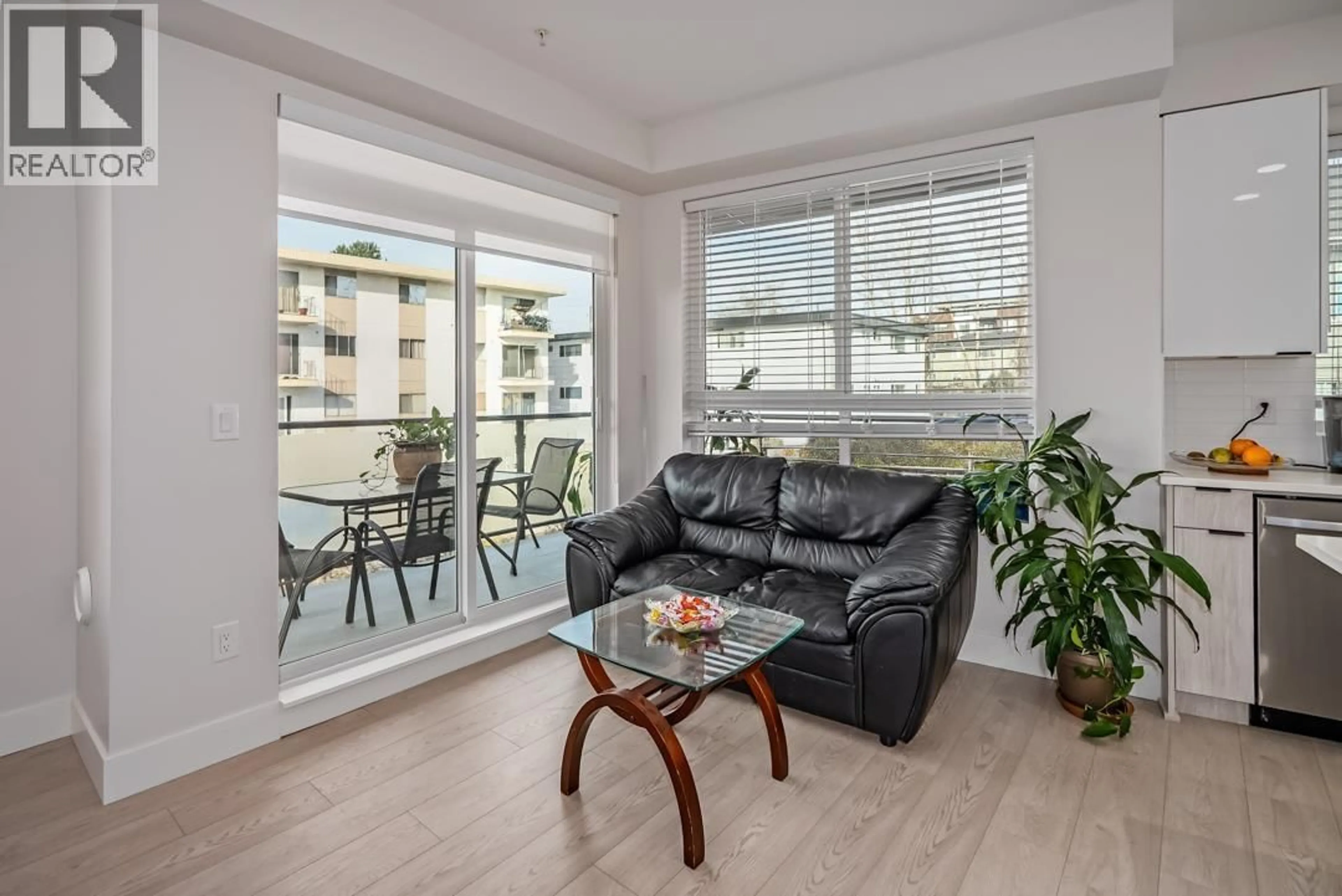 Living room with furniture, wood/laminate floor for 413 - 11655 FRASER STREET, Maple Ridge British Columbia V2X6W9