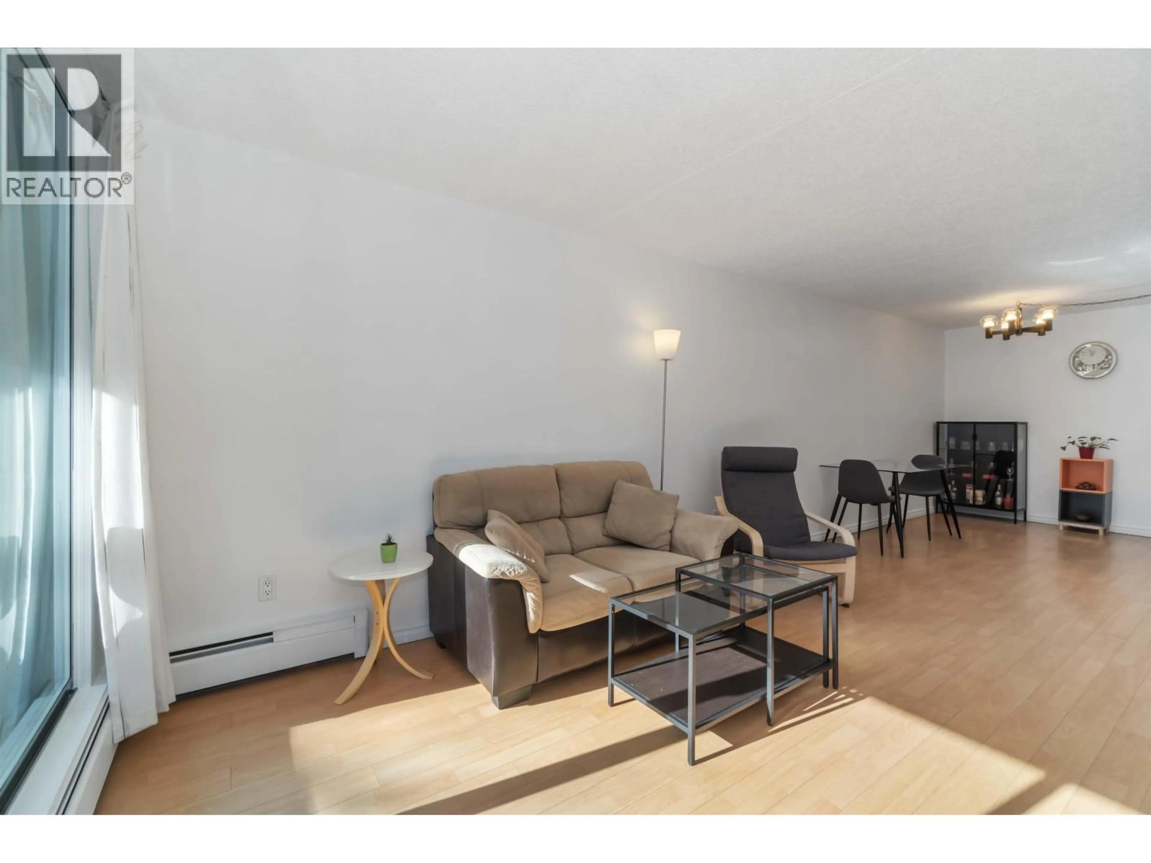 Living room with furniture, wood/laminate floor for 205 - 6595 WILLINGDON AVENUE, Burnaby British Columbia V5H4E5