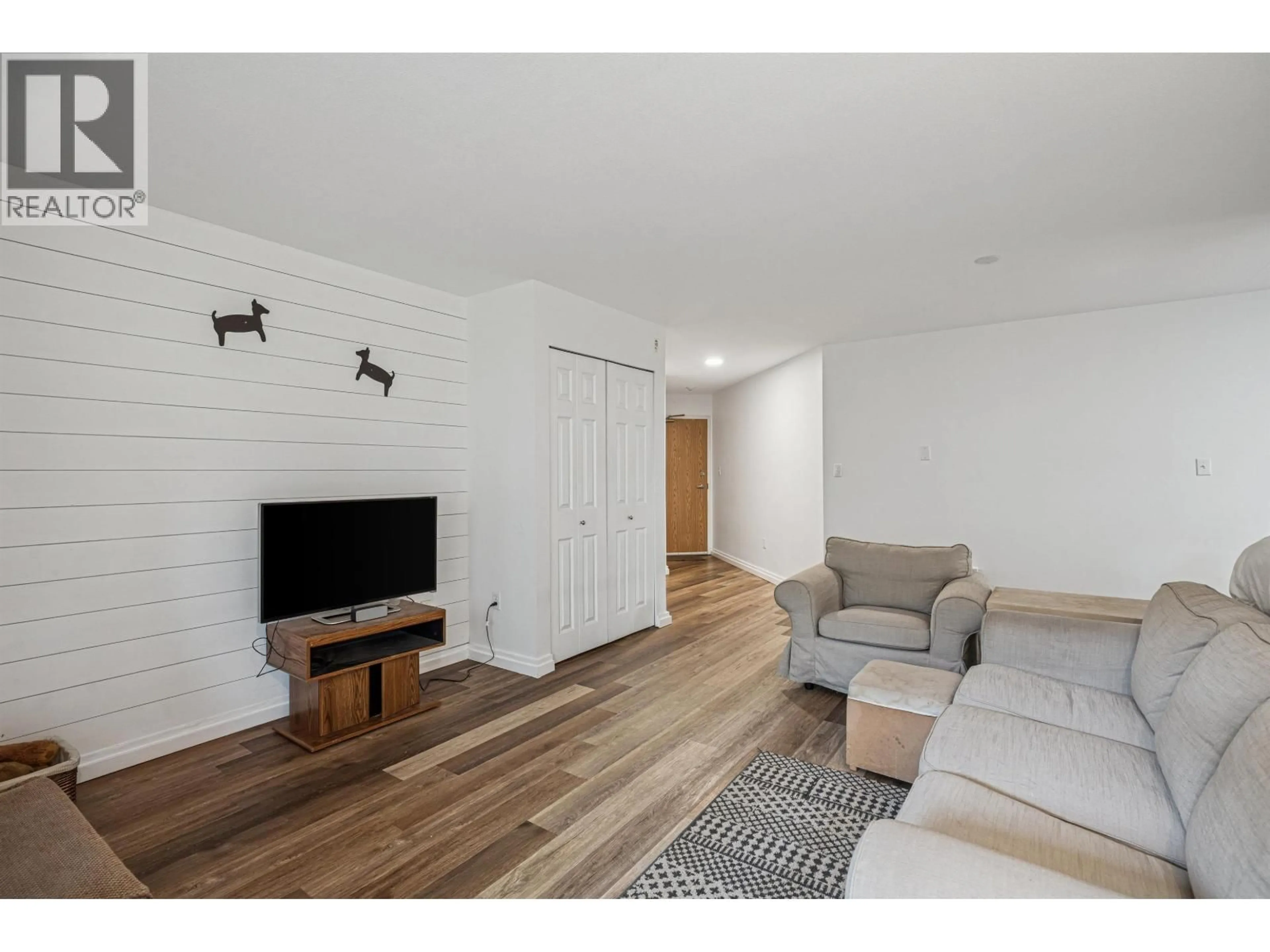 Living room with furniture, wood/laminate floor for 108 - 1200 PACIFIC STREET, Coquitlam British Columbia V3B6K2