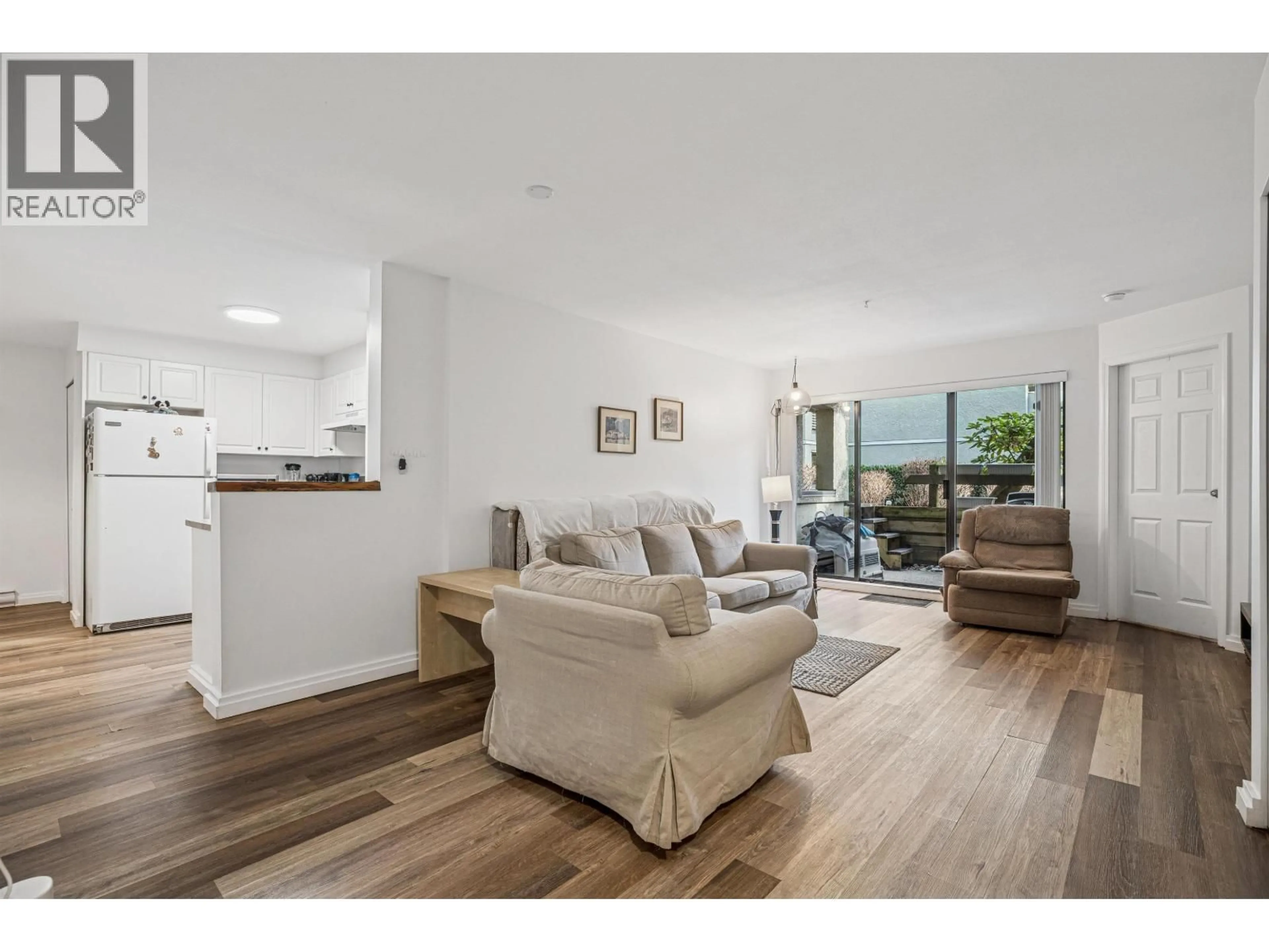 Living room with furniture, wood/laminate floor for 108 - 1200 PACIFIC STREET, Coquitlam British Columbia V3B6K2