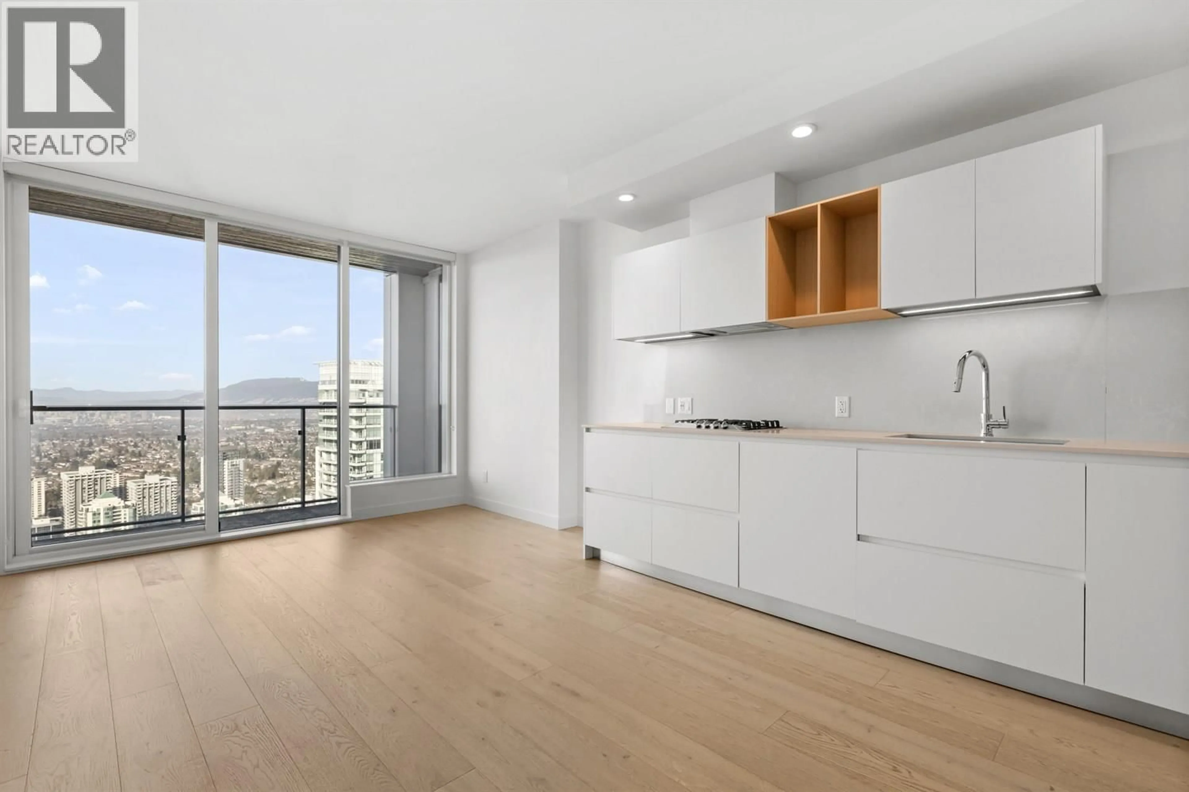Open concept kitchen, wood/laminate floor for 4406 - 6000 MCKAY AVENUE, Burnaby British Columbia V5H0K2