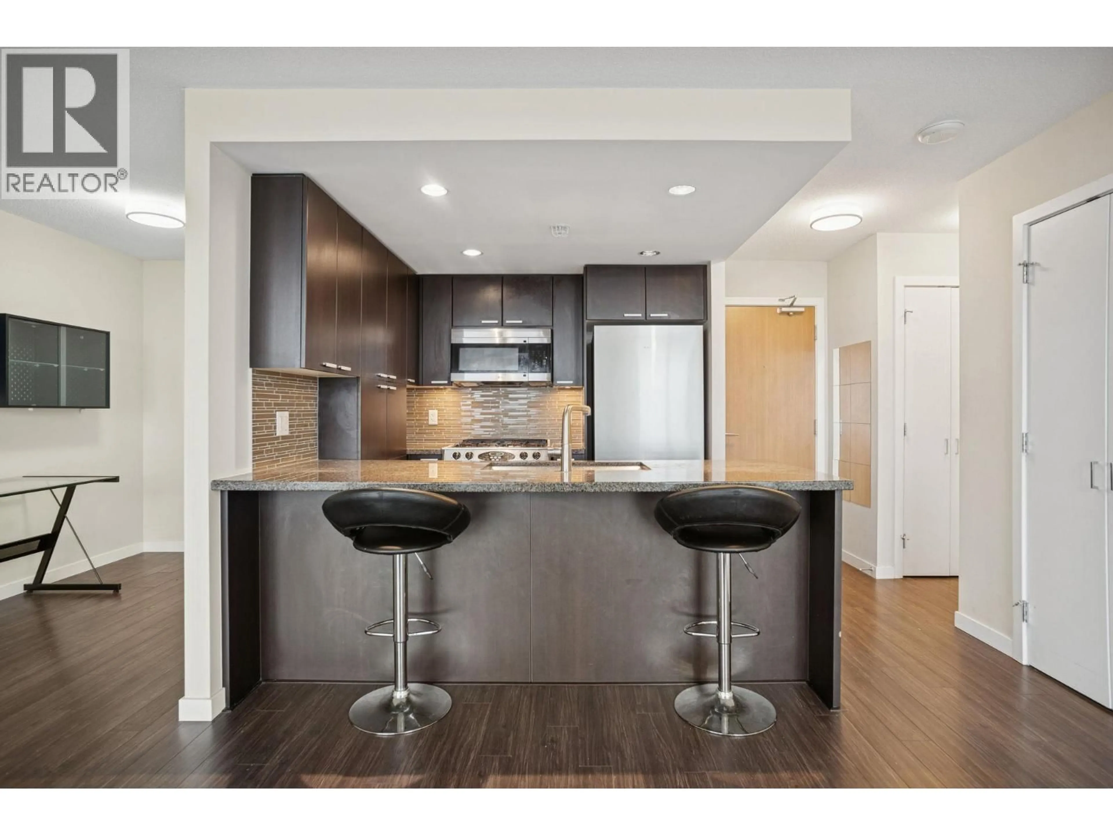 Open concept kitchen, wood/laminate floor for 2102 - 2232 DOUGLAS ROAD, Burnaby British Columbia V5C0G9