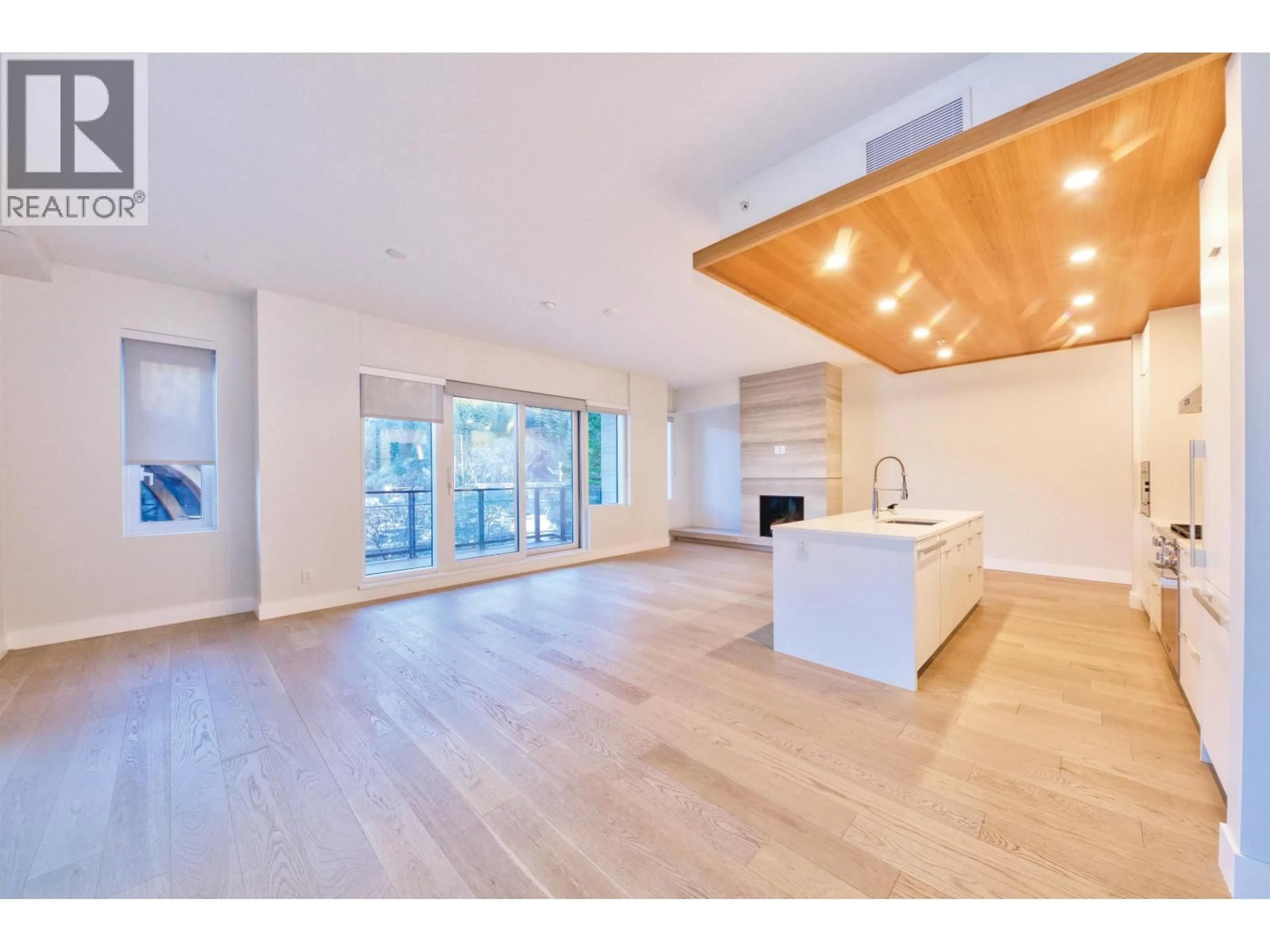 Open concept kitchen, wood/laminate floor for 201 - 6707 NELSON AVENUE, West Vancouver British Columbia V7W0A4