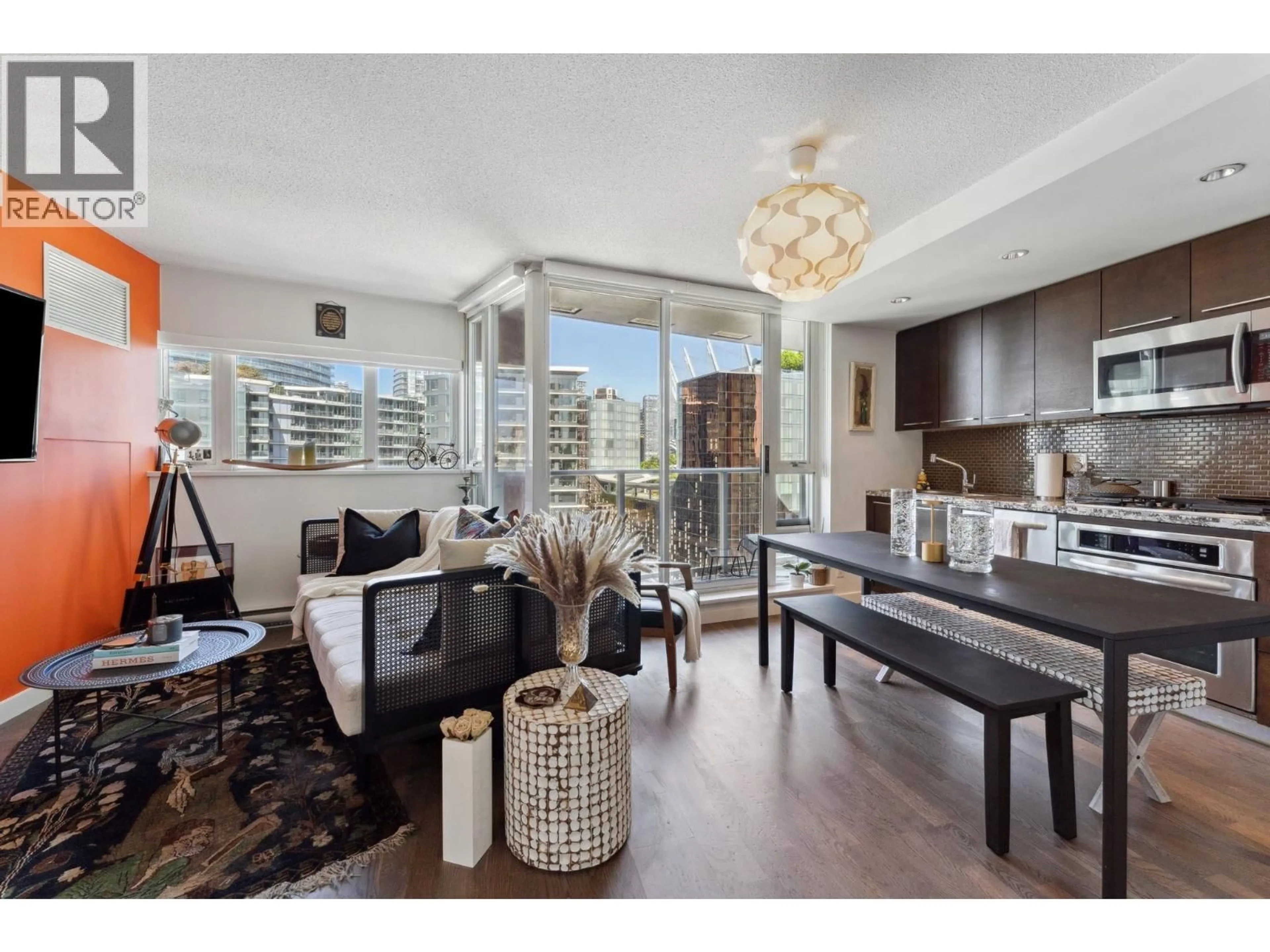 Living room with furniture, wood/laminate floor for 1701 - 918 COOPERAGE WAY, Vancouver British Columbia V6B0A7