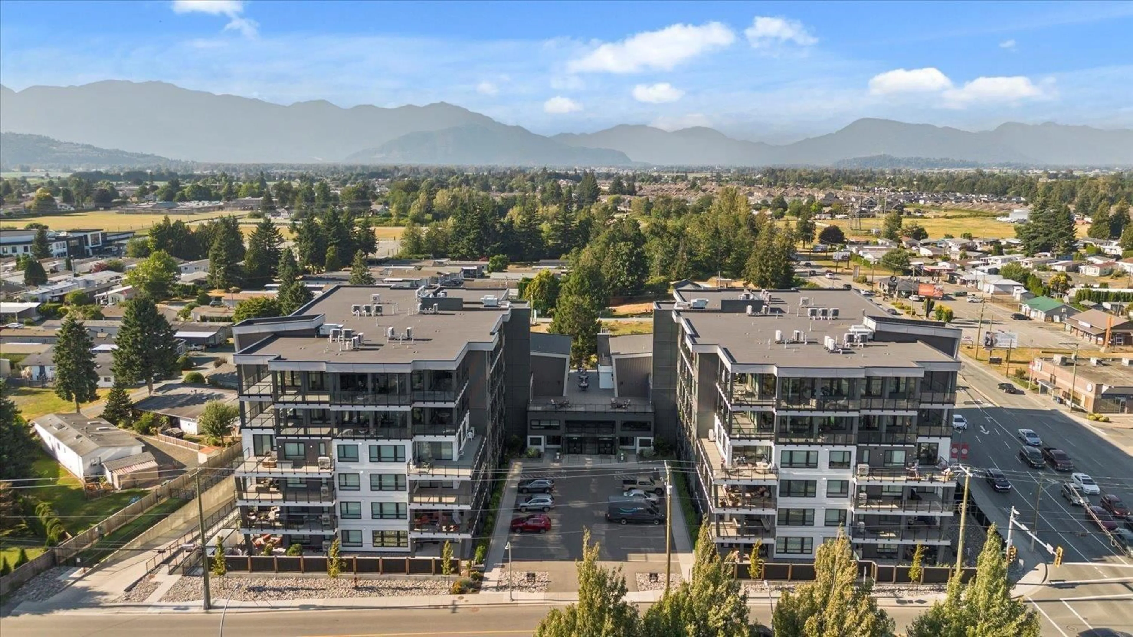 A pic from outside/outdoor area/front of a property/back of a property/a pic from drone, mountain view for 408 - 45757 WATSON ROAD, Chilliwack British Columbia V2R2H1