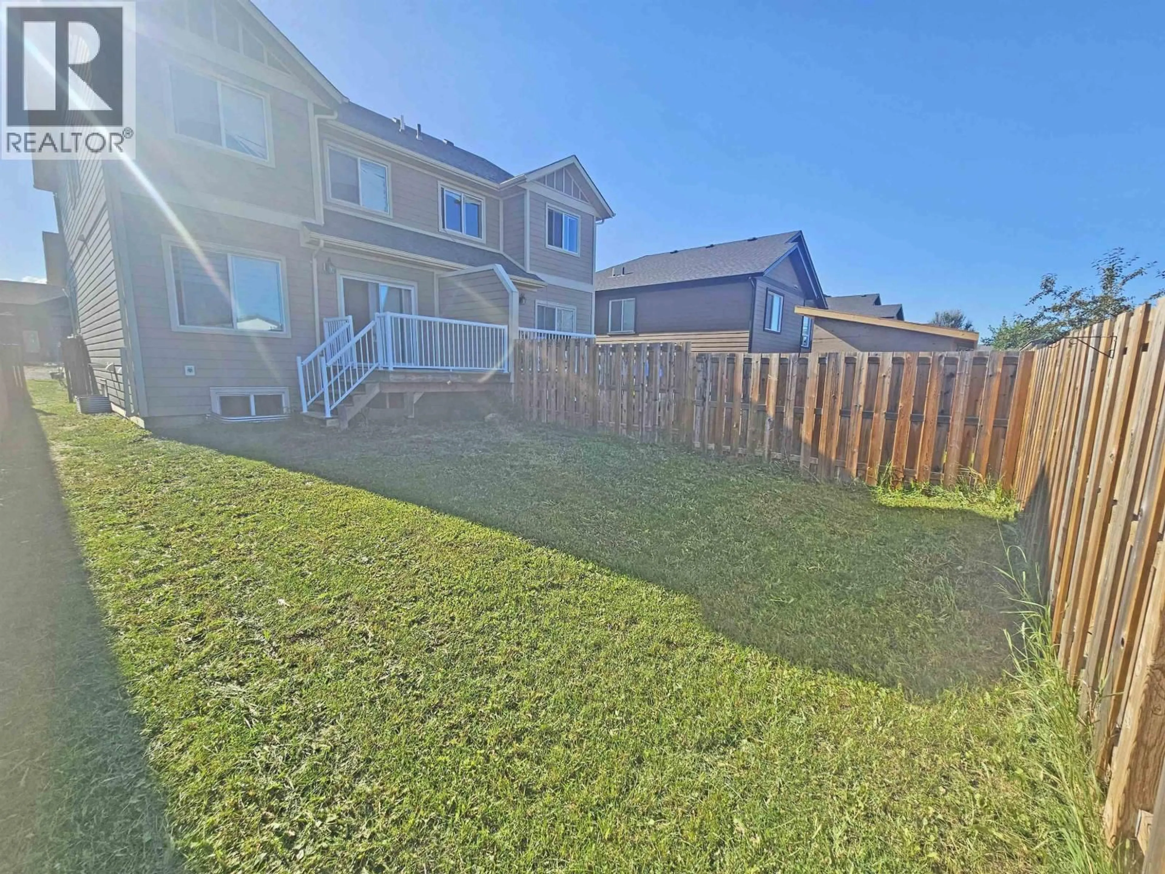 A pic from outside/outdoor area/front of a property/back of a property/a pic from drone, mountain view for 8713 82 STREET, Fort St. John British Columbia V1J0P5