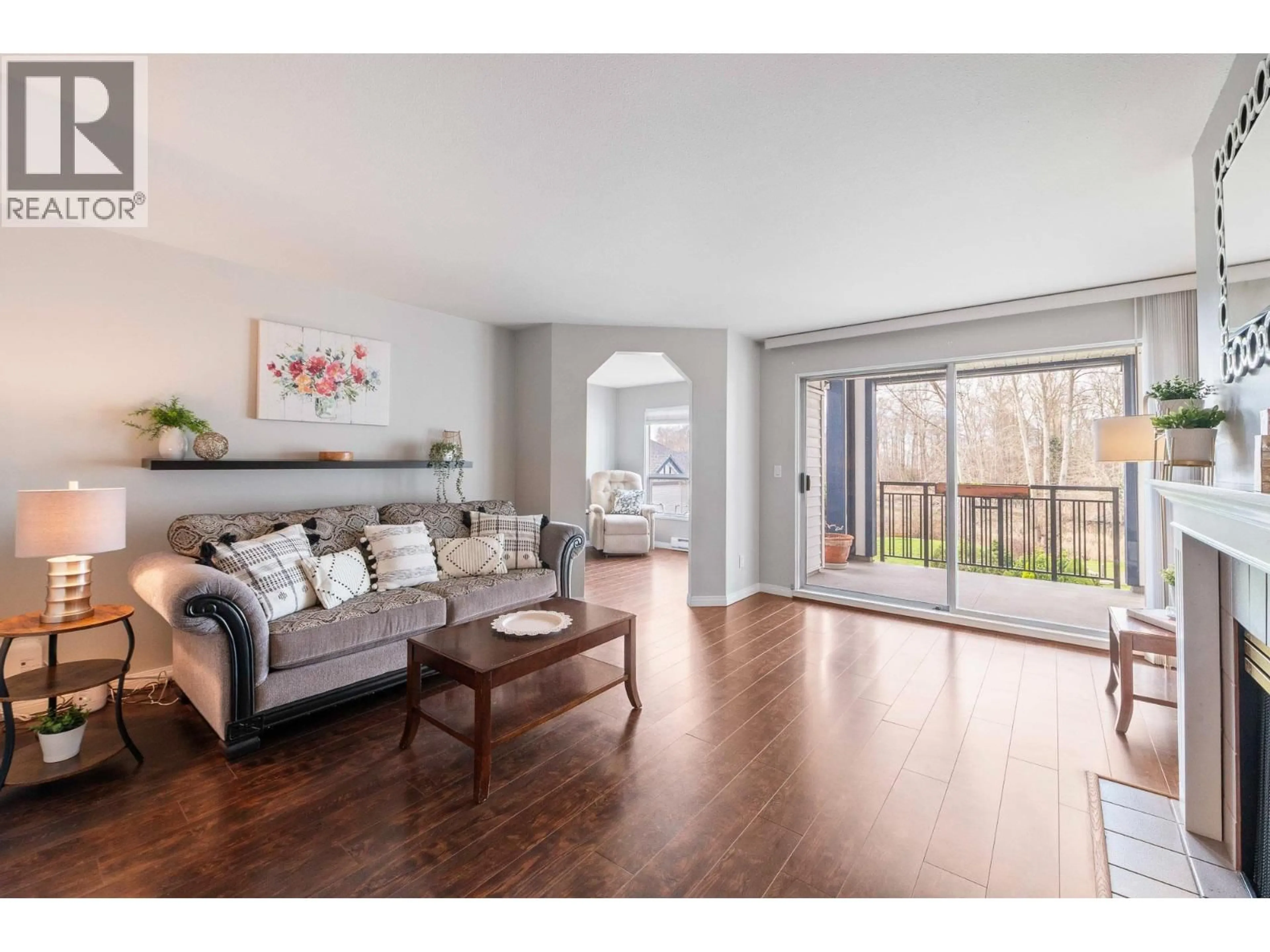 Living room with furniture, wood/laminate floor for 307 - 4955 RIVER ROAD, Delta British Columbia V4K4V9