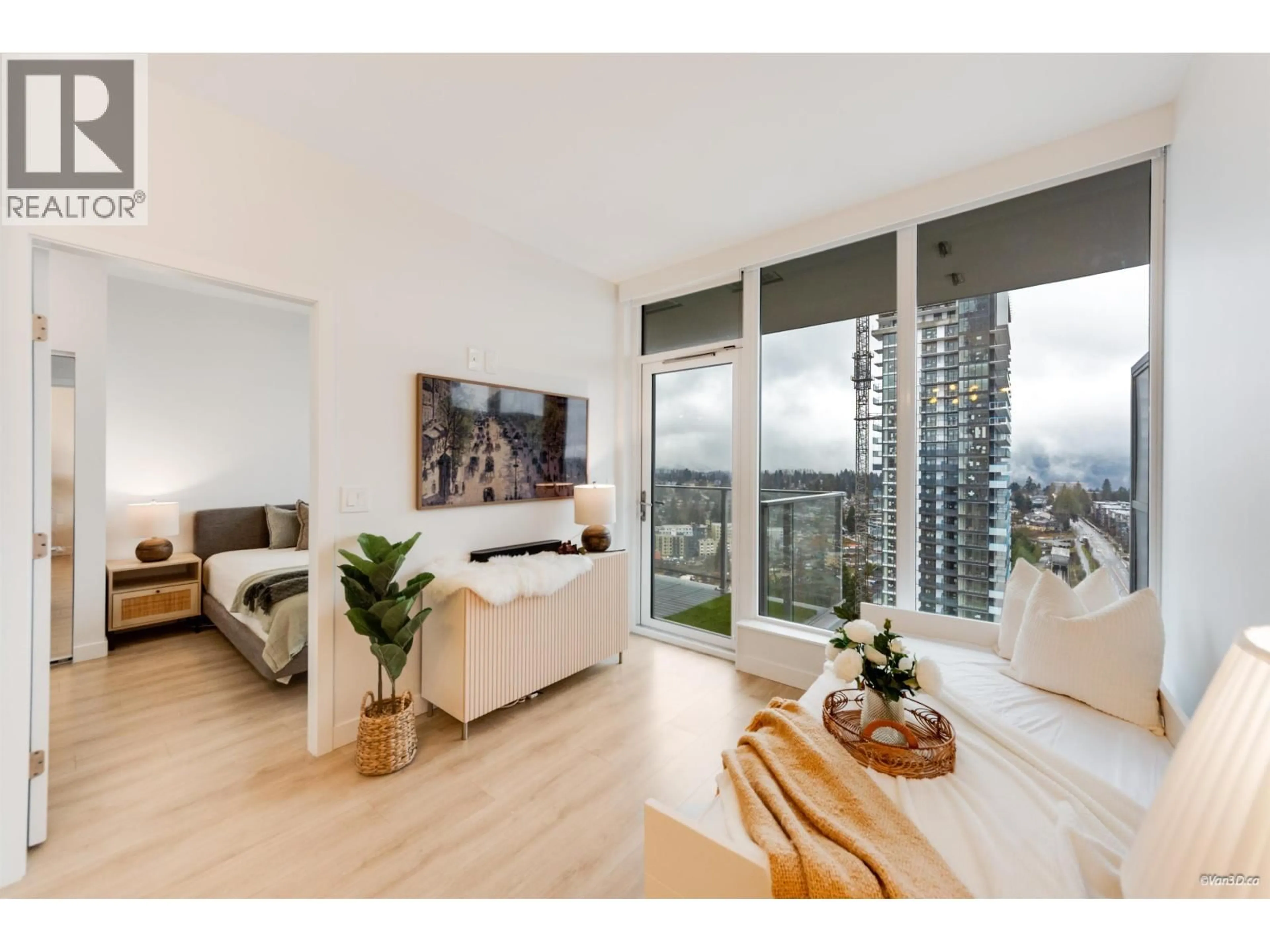 Living room with furniture, wood/laminate floor for 2505 - 567 CLARKE ROAD, Coquitlam British Columbia V3J0K7