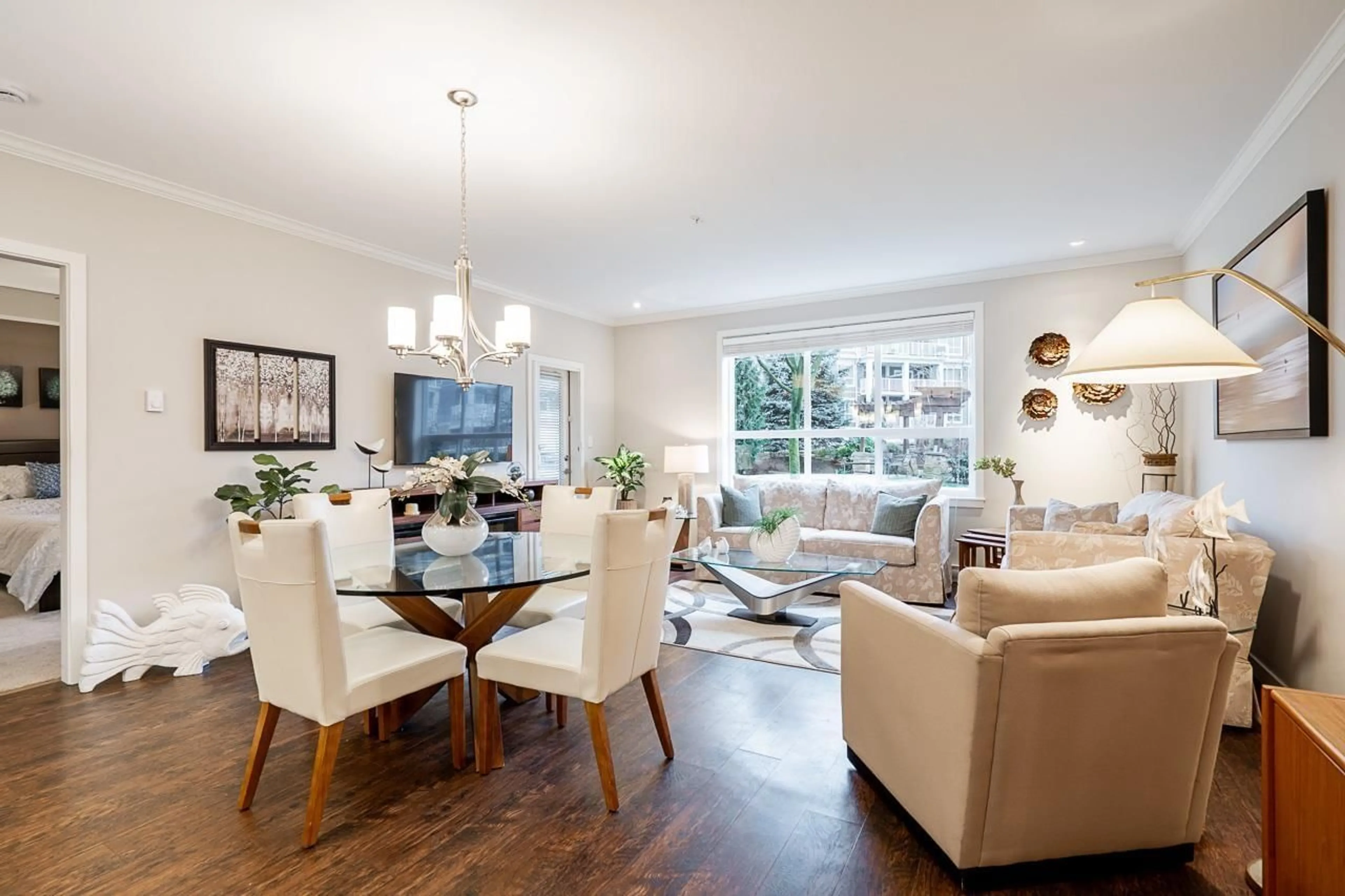 Living room with furniture, wood/laminate floor for 104 - 6480 194 STREET, Surrey British Columbia V4N6J9