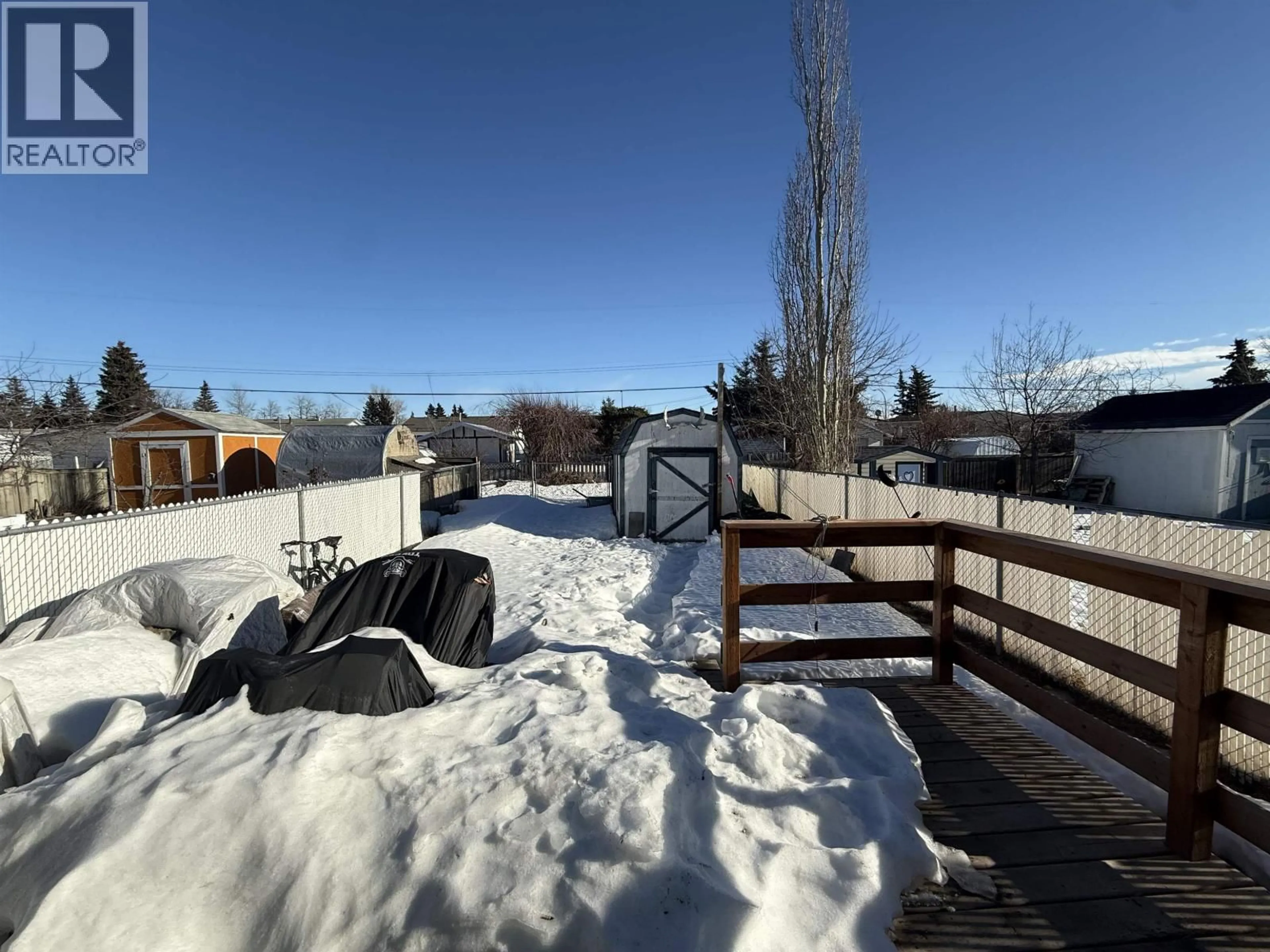 A pic from outside/outdoor area/front of a property/back of a property/a pic from drone, mountain view for 8807 79A STREET, Fort St. John British Columbia V1J6W8