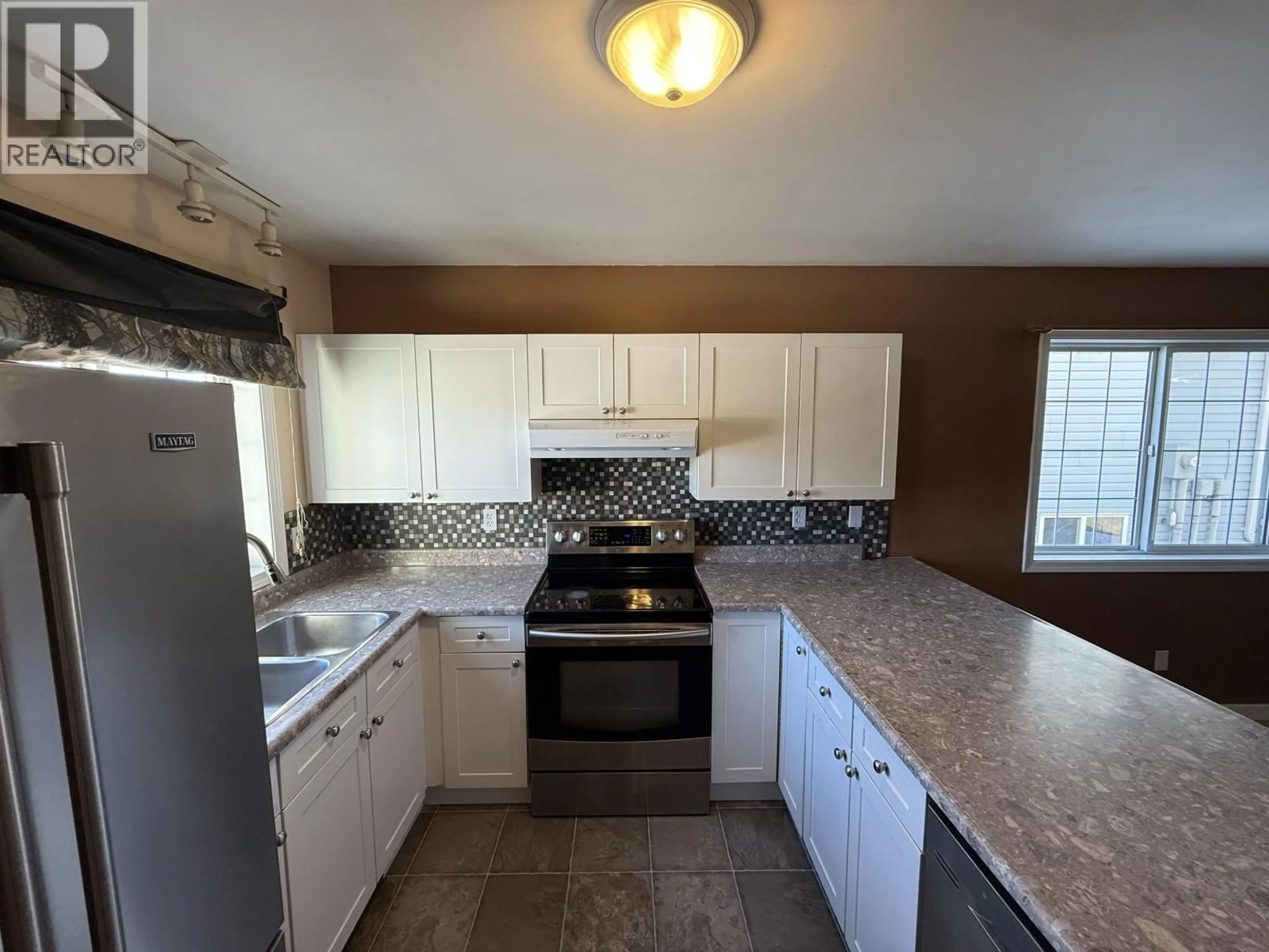Standard kitchen, ceramic/tile floor for 8807 79A STREET, Fort St. John British Columbia V1J6W8