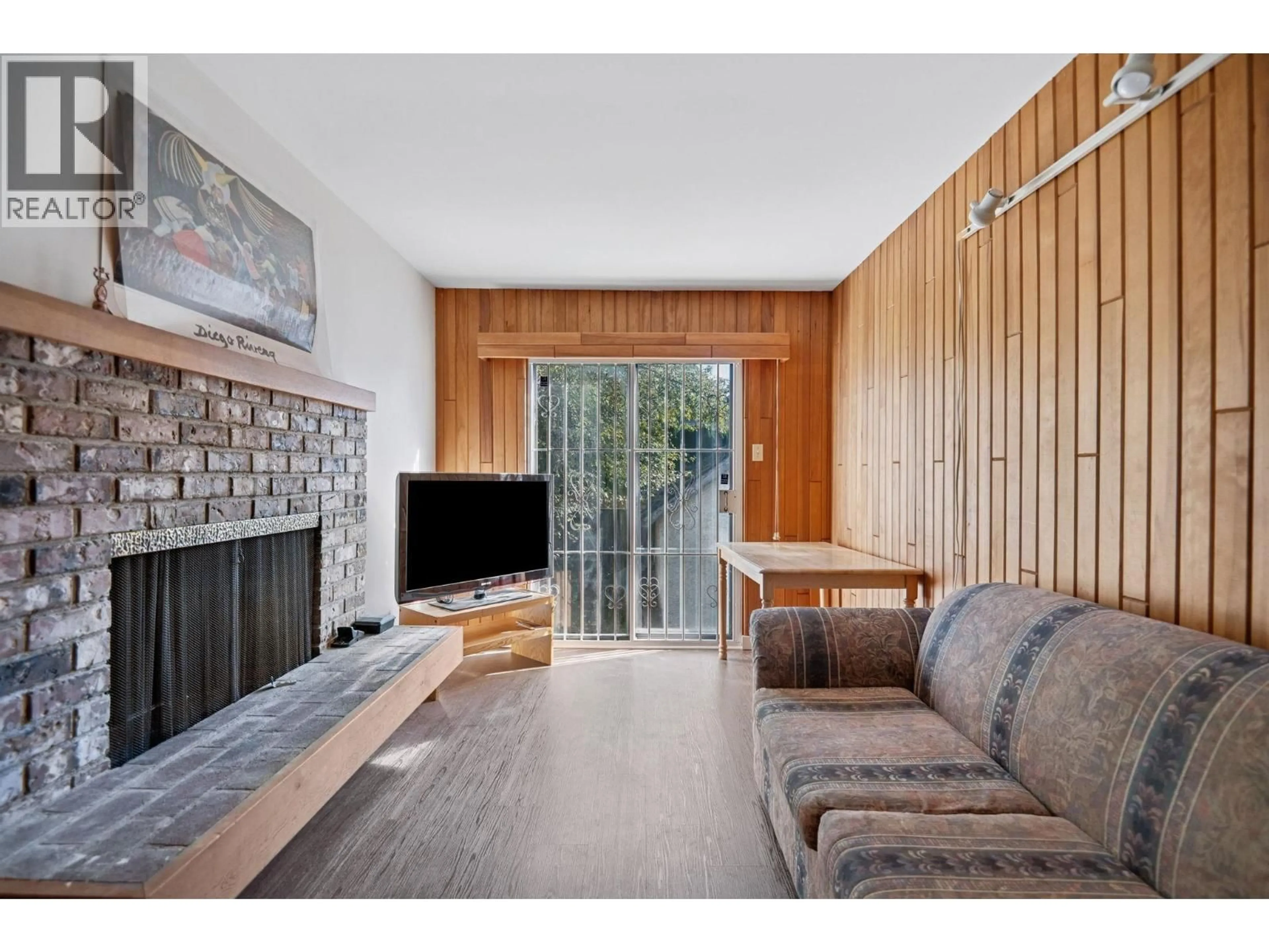 Living room with furniture, wood/laminate floor for 4470 OSLER STREET, Vancouver British Columbia V6H2X9