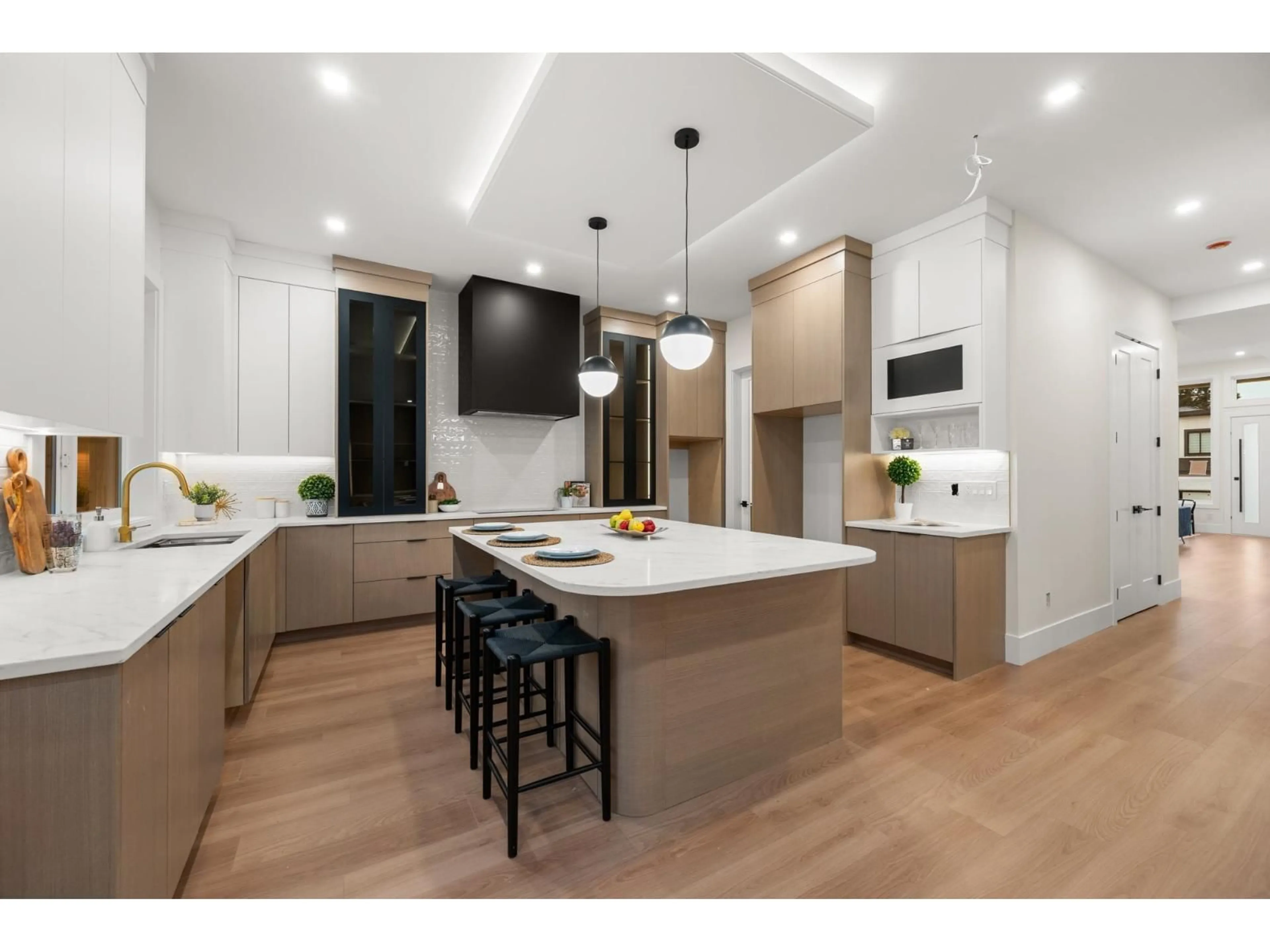 Open concept kitchen, wood/laminate floor for 11472 138A STREET, Surrey British Columbia V3R0J3