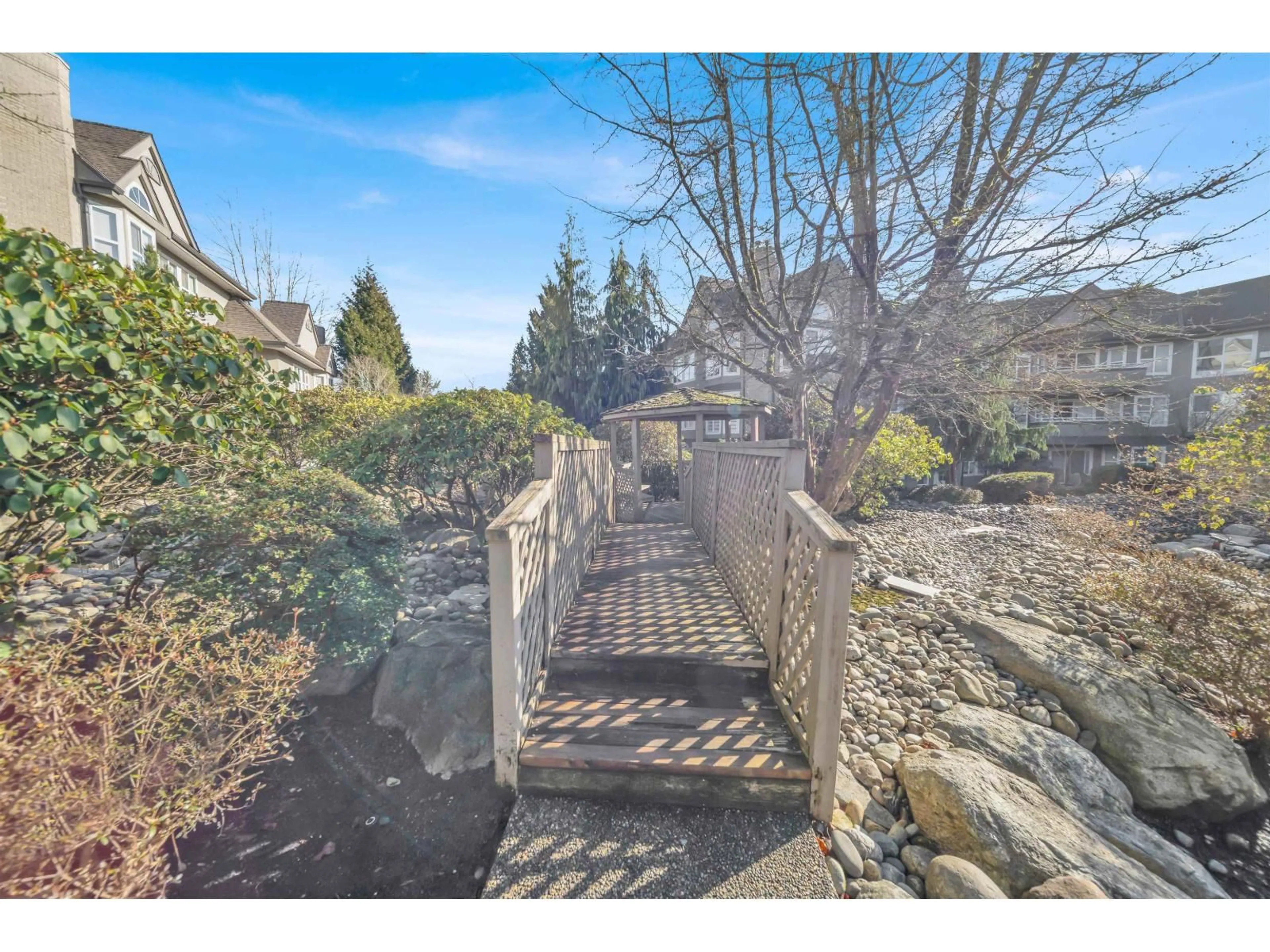 A pic from outside/outdoor area/front of a property/back of a property/a pic from drone, water/lake/river/ocean view for 212 - 6557 121 STREET, Surrey British Columbia V3W1E7