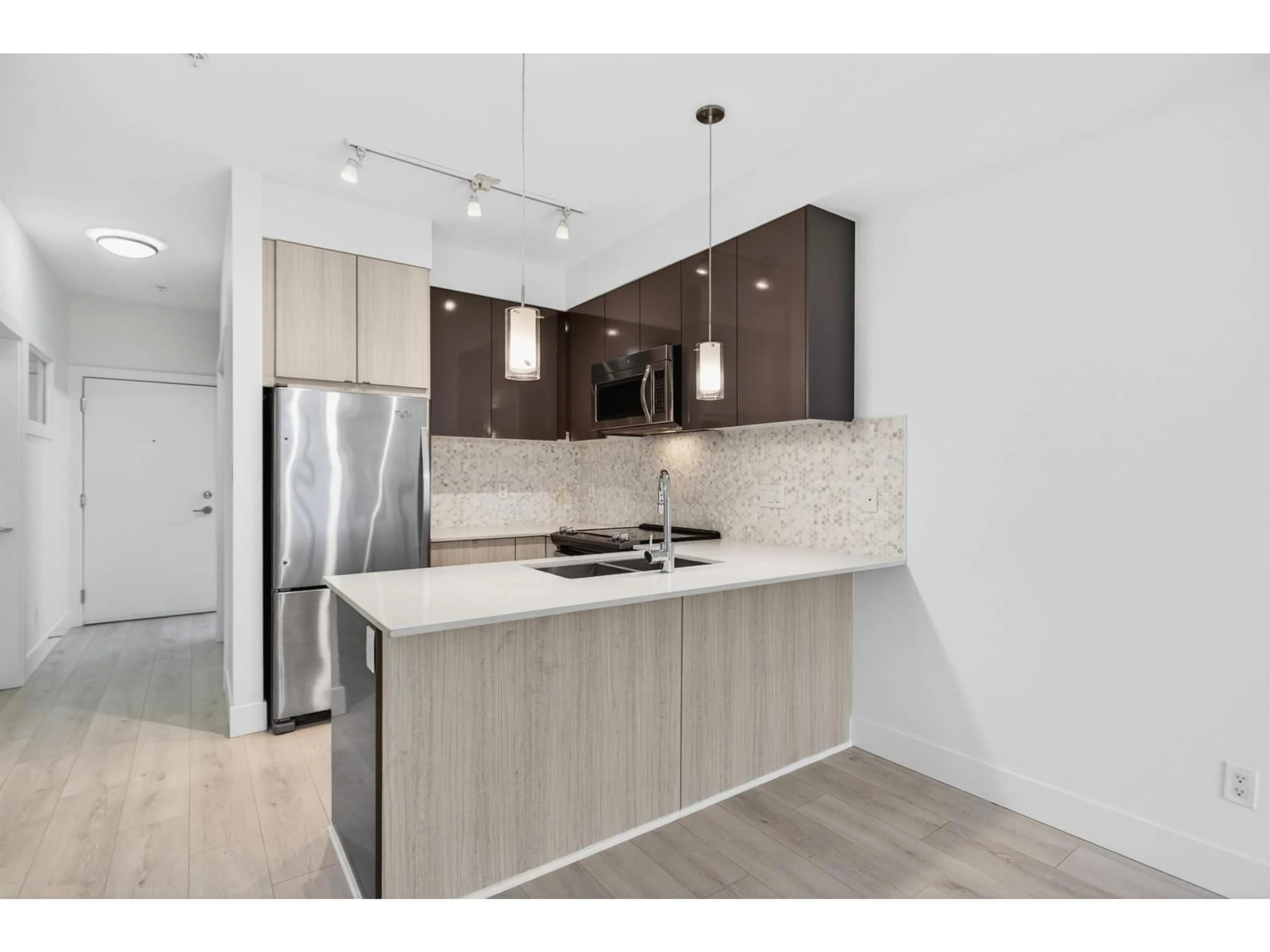 Open concept kitchen, unknown for 310 - 6468 195A STREET, Surrey British Columbia V4N6R6