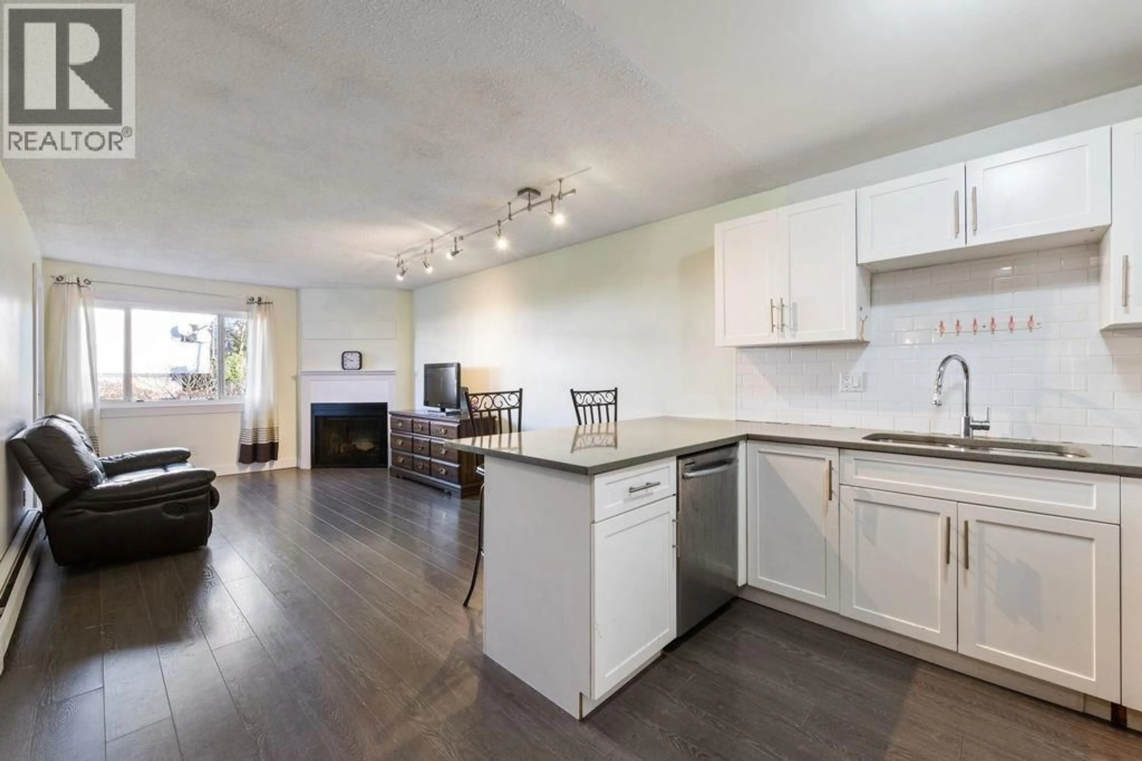 Open concept kitchen, wood/laminate floor for 204 - 1209 HOWIE AVENUE, Coquitlam British Columbia V3J1T9