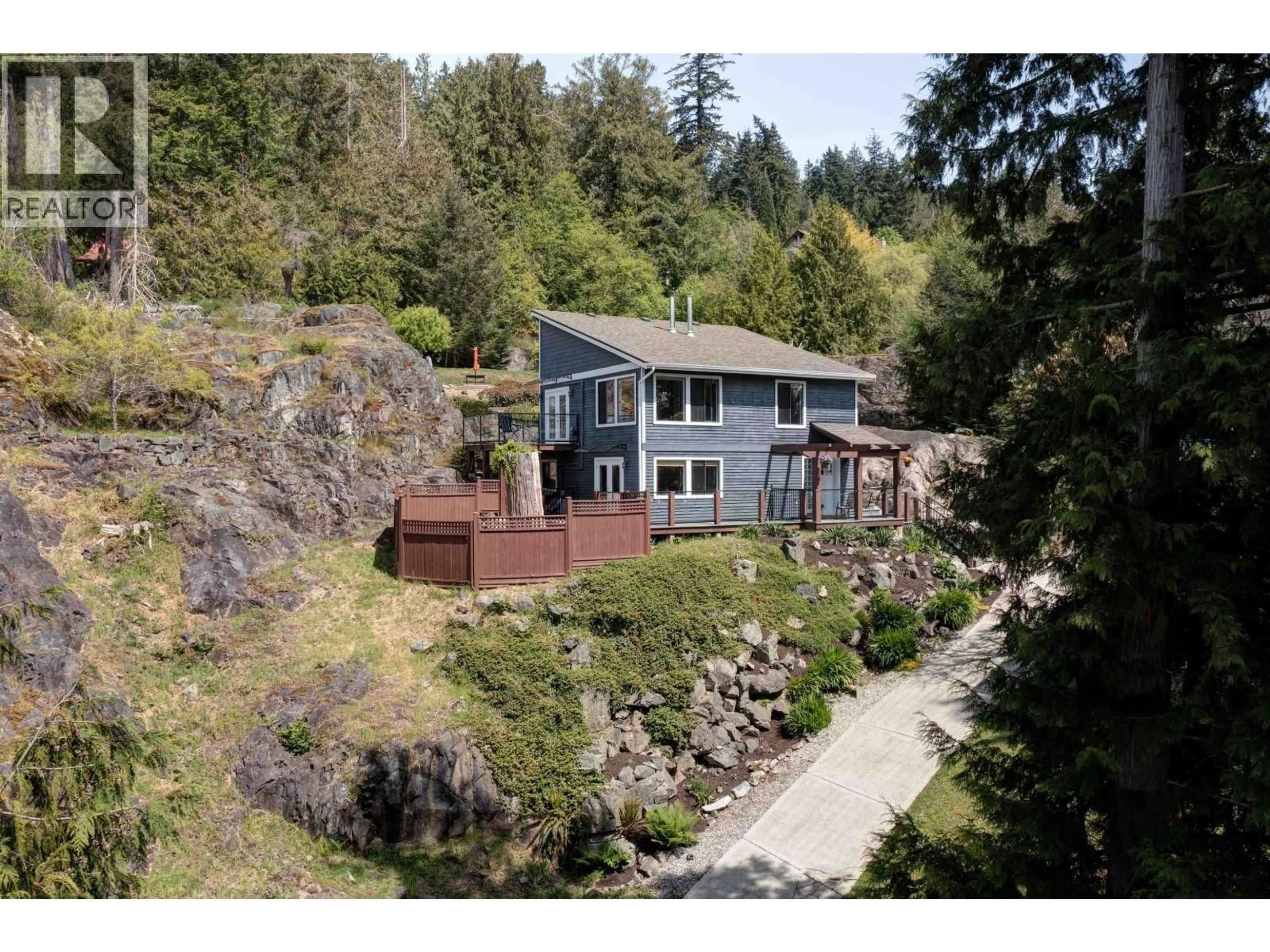 A pic from outside/outdoor area/front of a property/back of a property/a pic from drone, water/lake/river/ocean view for 8362 REDROOFFS ROAD, Halfmoon Bay British Columbia V7Z1E5
