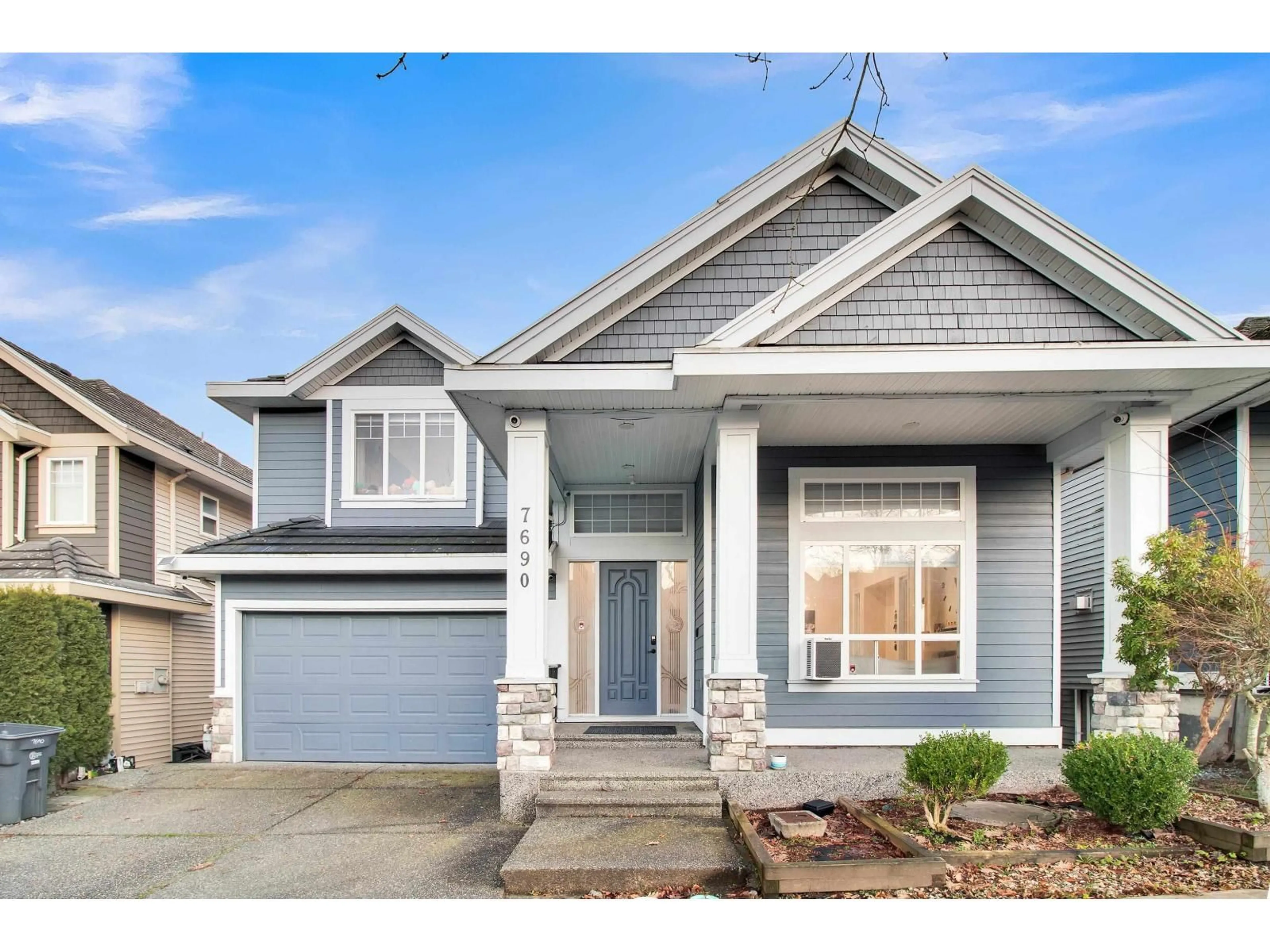 Home with vinyl exterior material, street for 7690 146A STREET, Surrey British Columbia V3S2T3