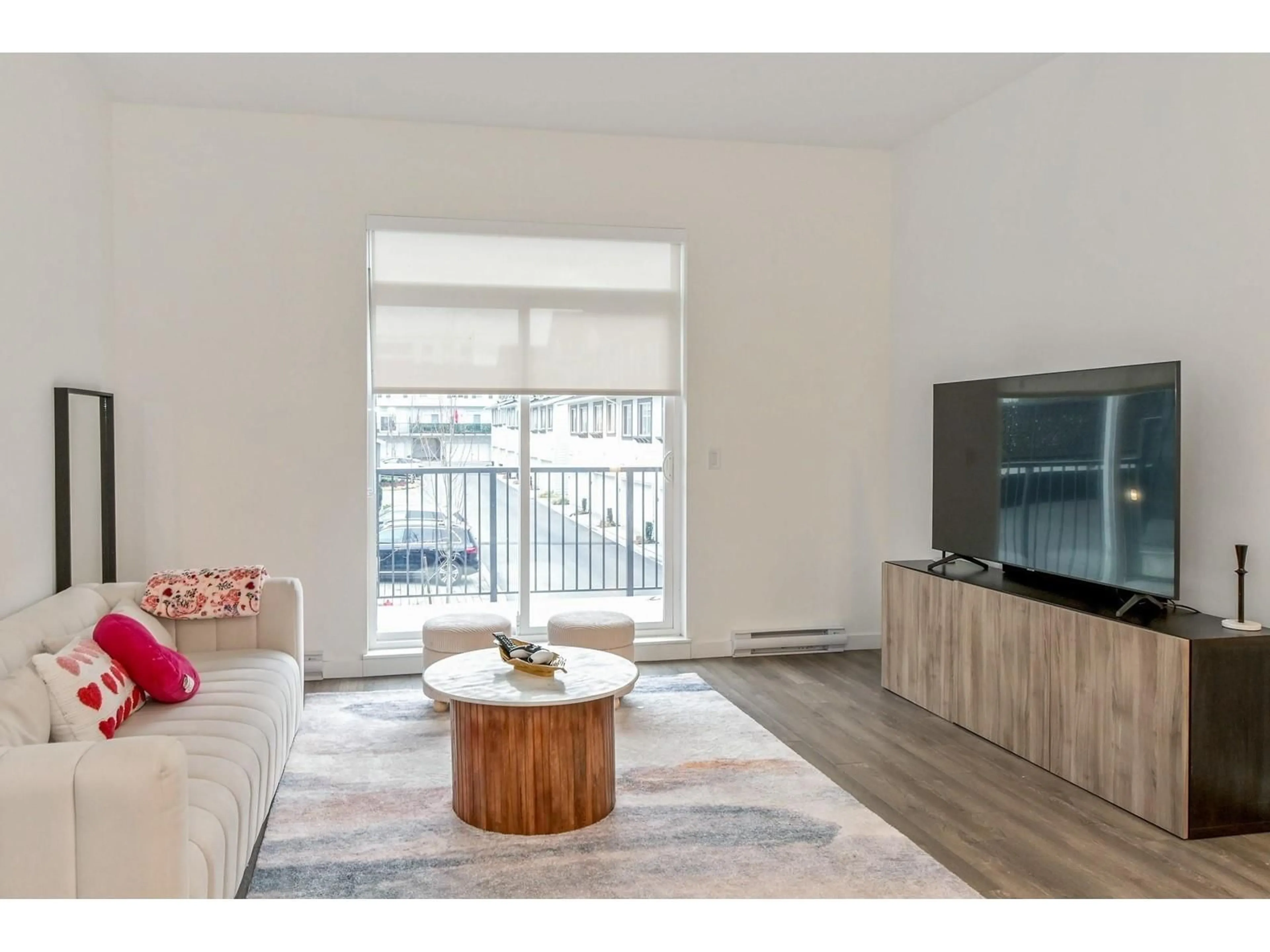 Living room with furniture, wood/laminate floor for 74 - 15778 85 AVENUE, Surrey British Columbia V4N6W8