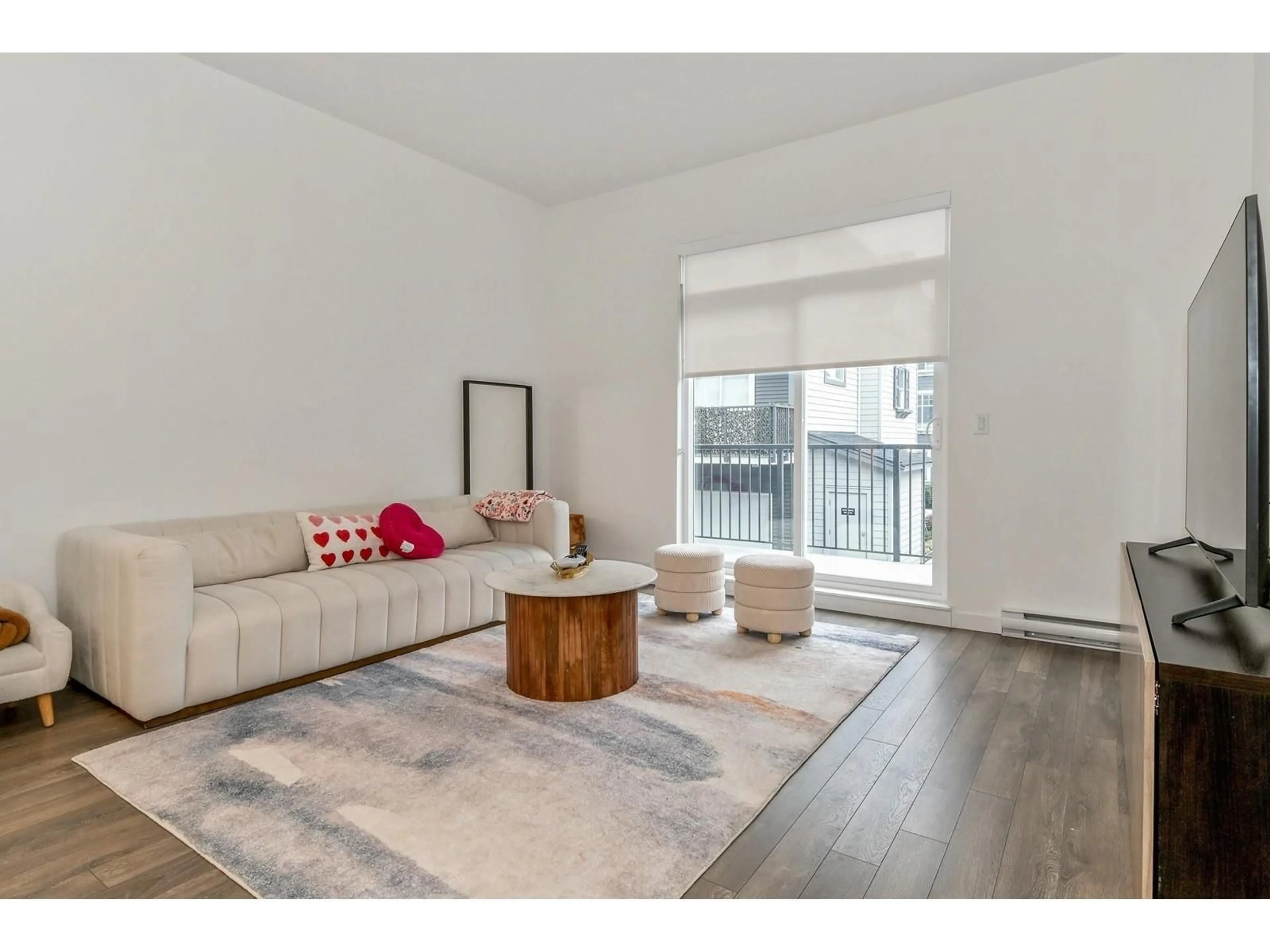 Living room with furniture, wood/laminate floor for 74 - 15778 85 AVENUE, Surrey British Columbia V4N6W8