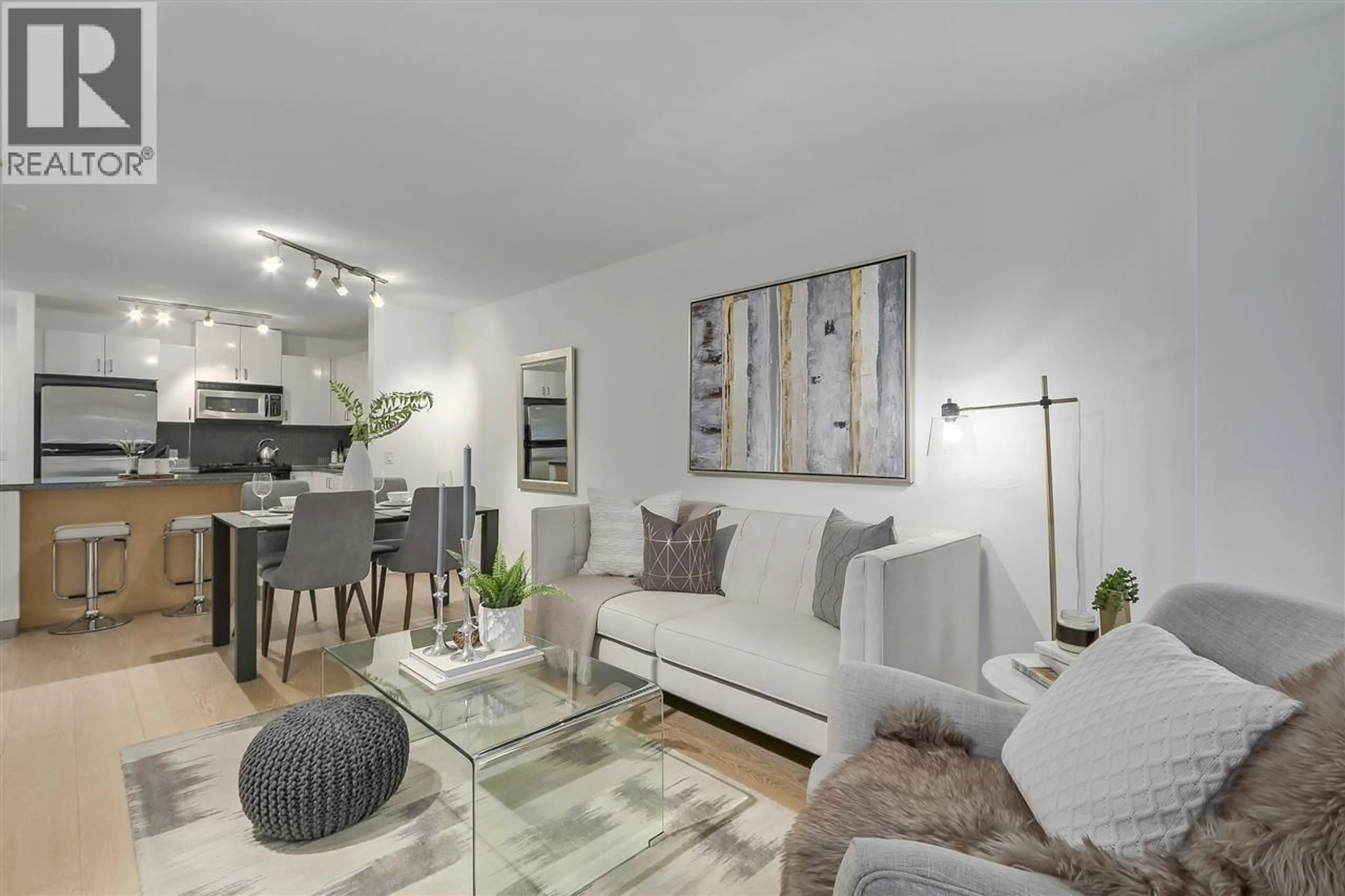 Living room with furniture, unknown for 104 - 175 1ST STREET, North Vancouver British Columbia V7M3N9