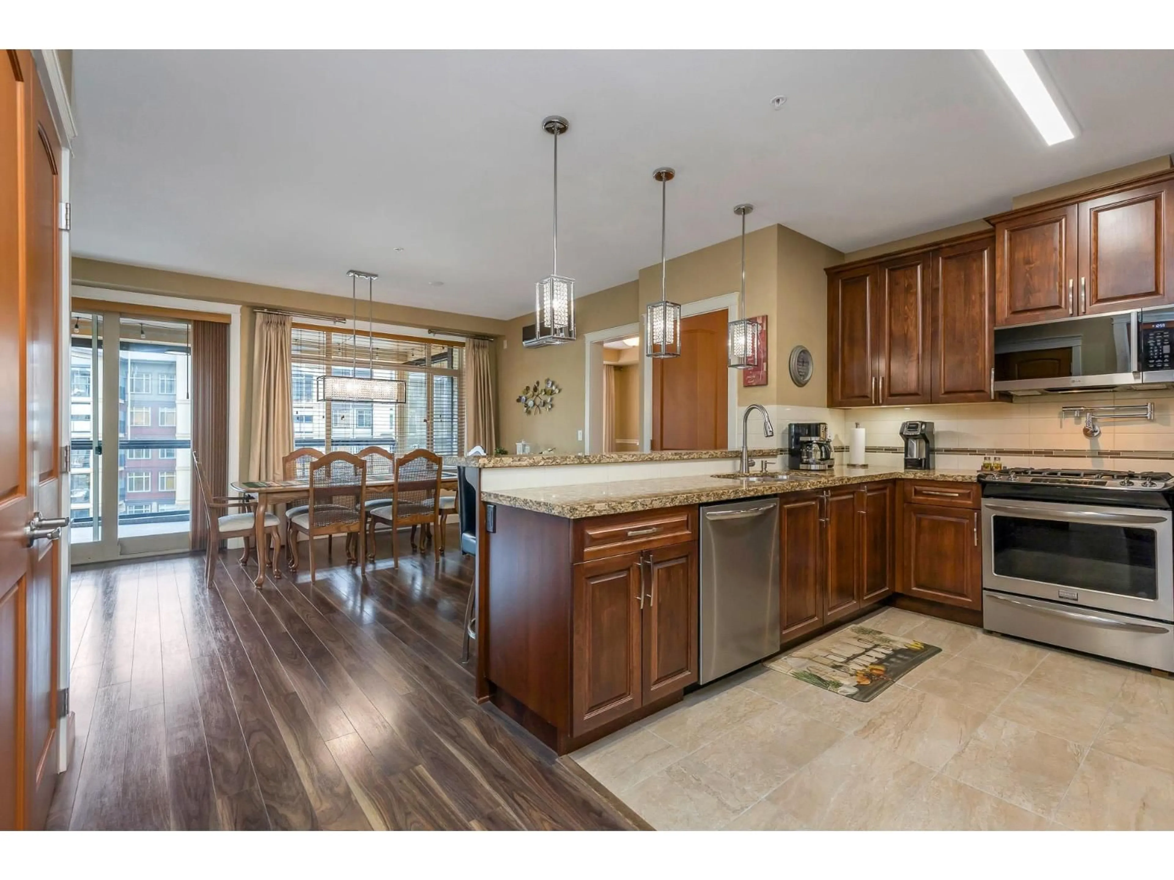 Open concept kitchen, unknown for 409 - 2860 TRETHEWEY STREET, Abbotsford British Columbia V2T5M4