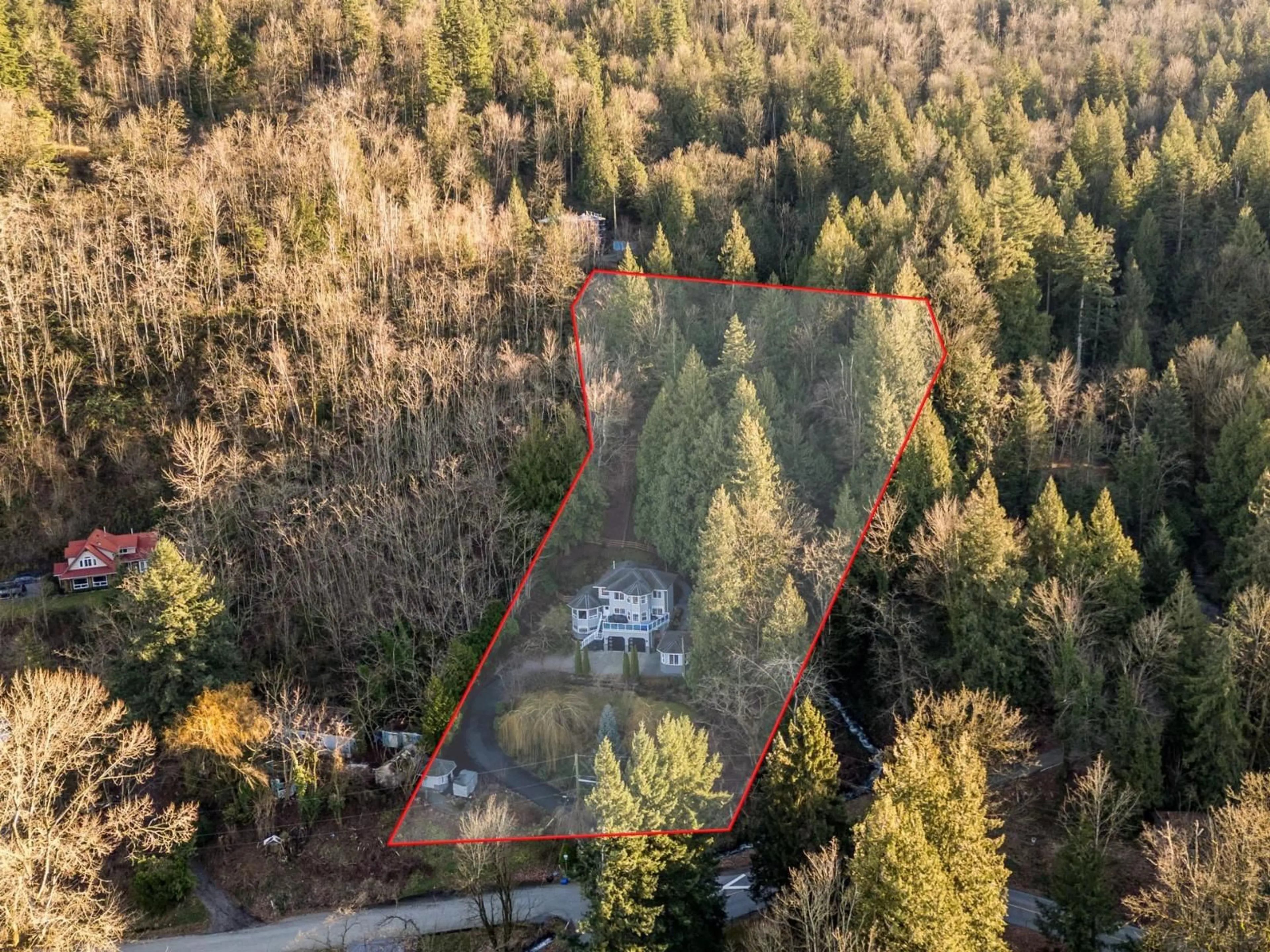 A pic from outside/outdoor area/front of a property/back of a property/a pic from drone, forest/trees view for 42602 MAJUBA HILL ROAD, Yarrow British Columbia V2R5H3