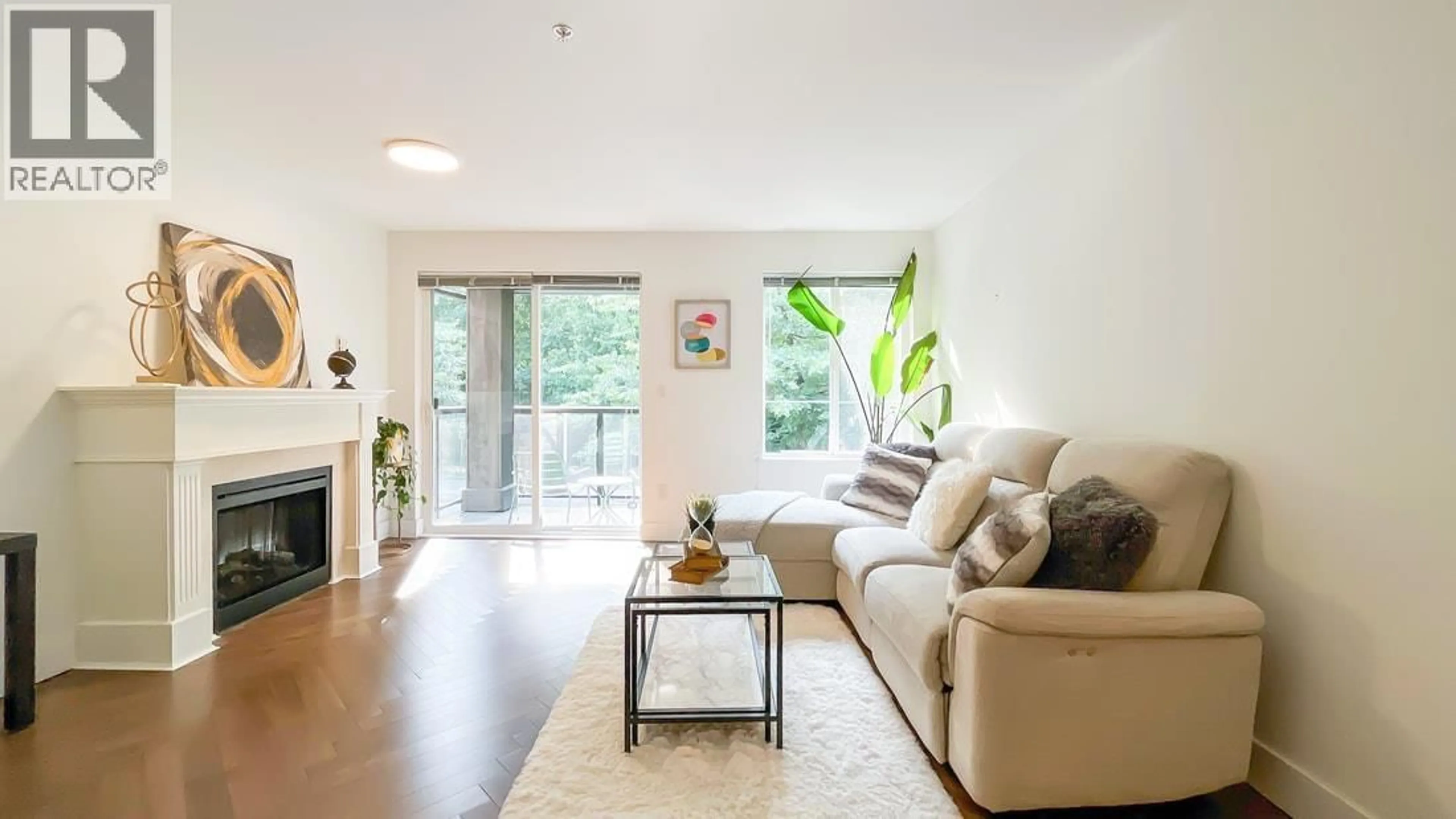 Living room with furniture, wood/laminate floor for 312 - 7000 21 AVENUE, Burnaby British Columbia V5E4P1