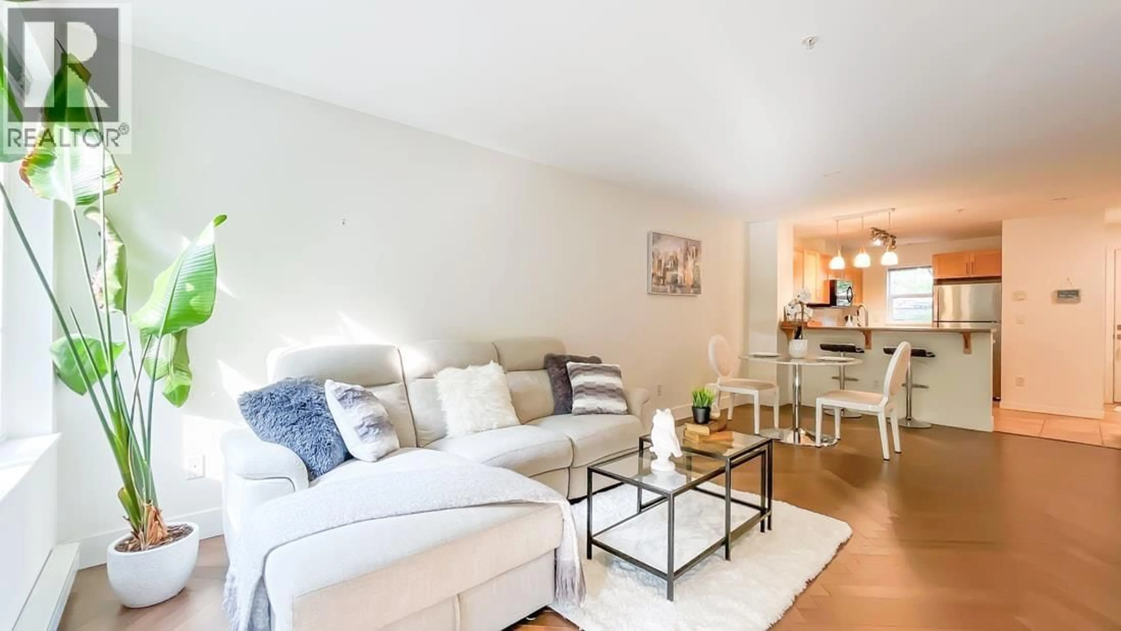 Living room with furniture, wood/laminate floor for 312 - 7000 21 AVENUE, Burnaby British Columbia V5E4P1