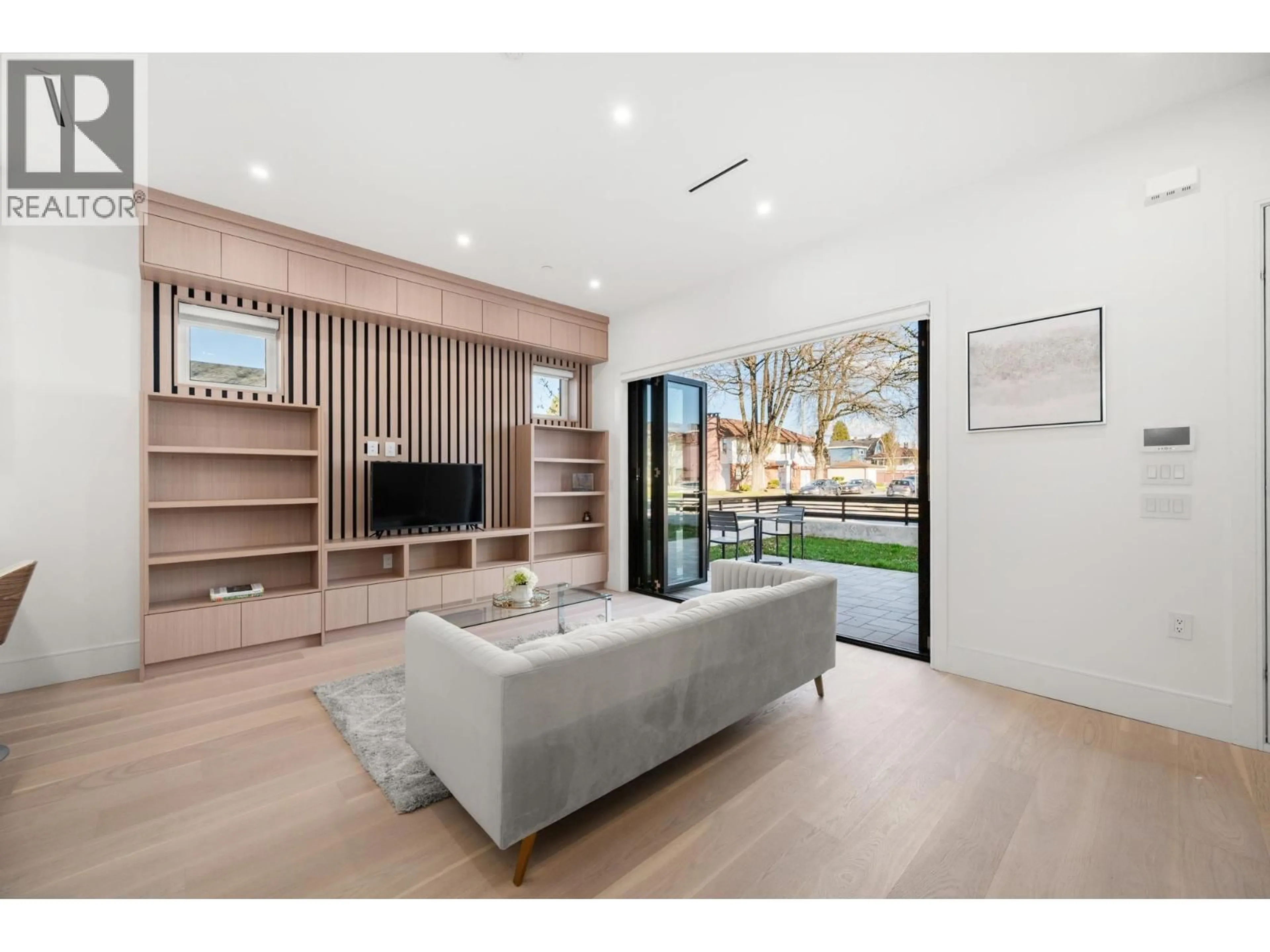 Living room with furniture, wood/laminate floor for 6307 CHESTER STREET, Vancouver British Columbia V5W3C4