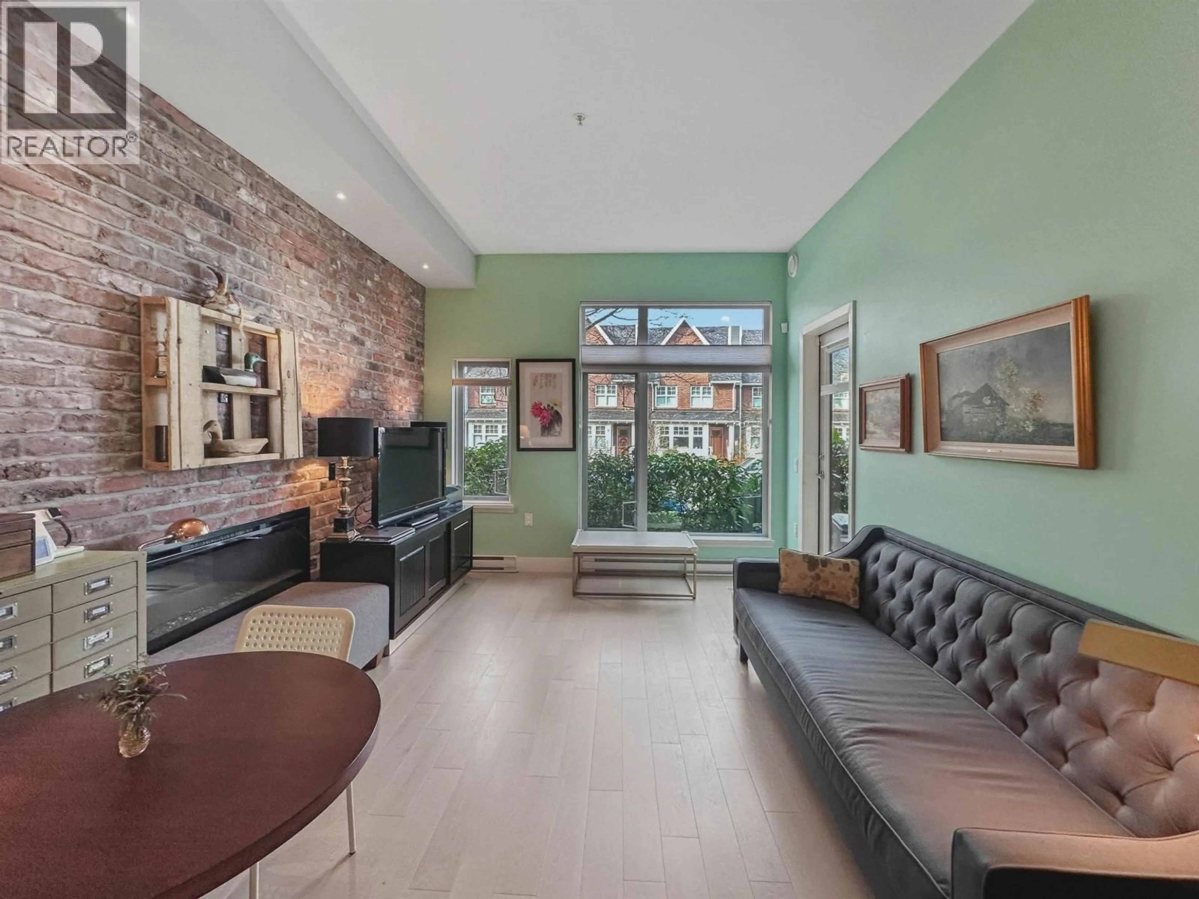 Living room with furniture, cement floor for 104 - 260 SALTER STREET, New Westminster British Columbia V3M0J4