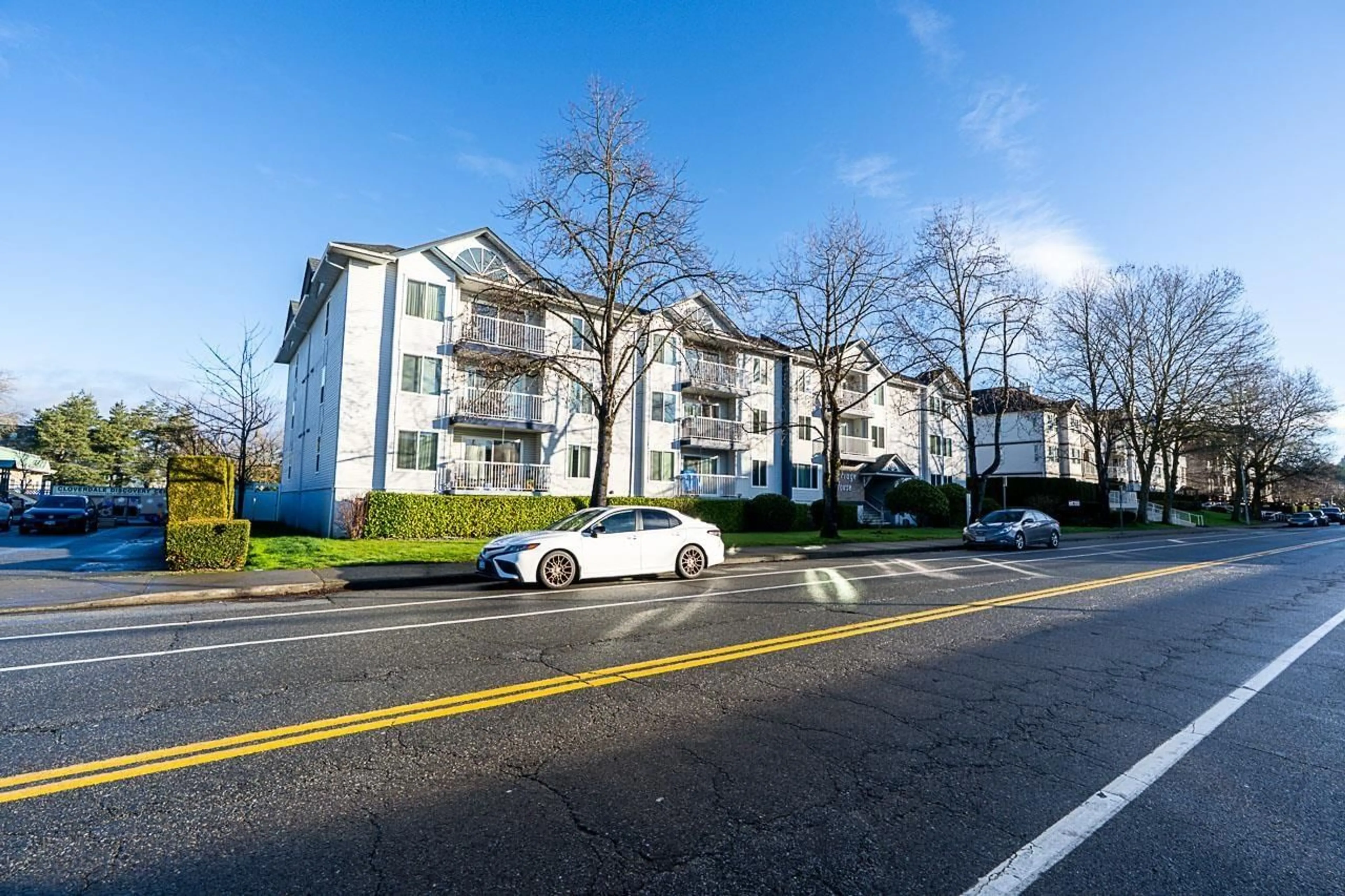 A pic from outside/outdoor area/front of a property/back of a property/a pic from drone, street for 305 - 17695 58 AVENUE, Surrey British Columbia V3S1L5