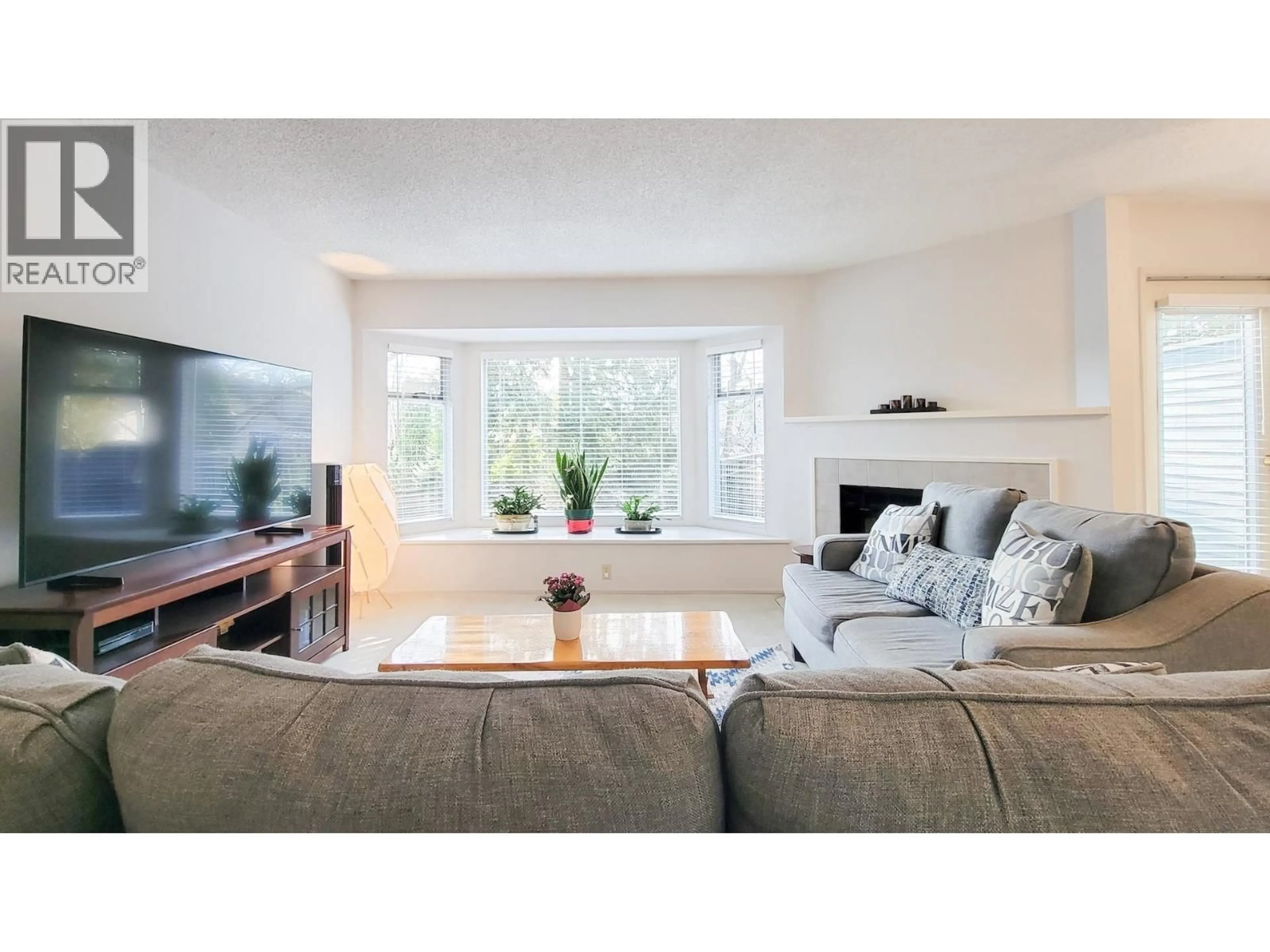 Living room with furniture, wood/laminate floor for 68 - 1195 FALCON DRIVE, Coquitlam British Columbia V3E2H1