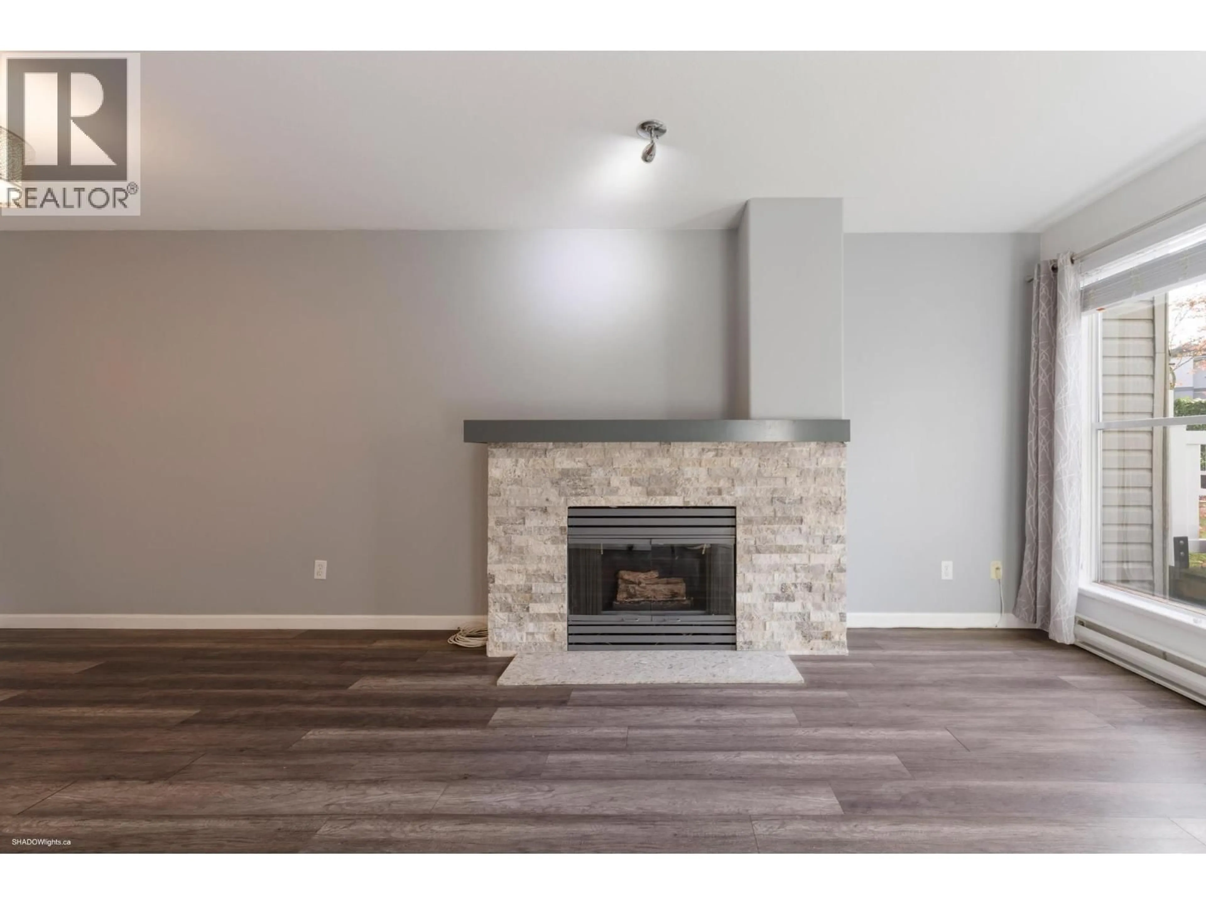 Living room with furniture, wood/laminate floor for 125 - 8880 JONES ROAD, Richmond British Columbia V6Y3Z1