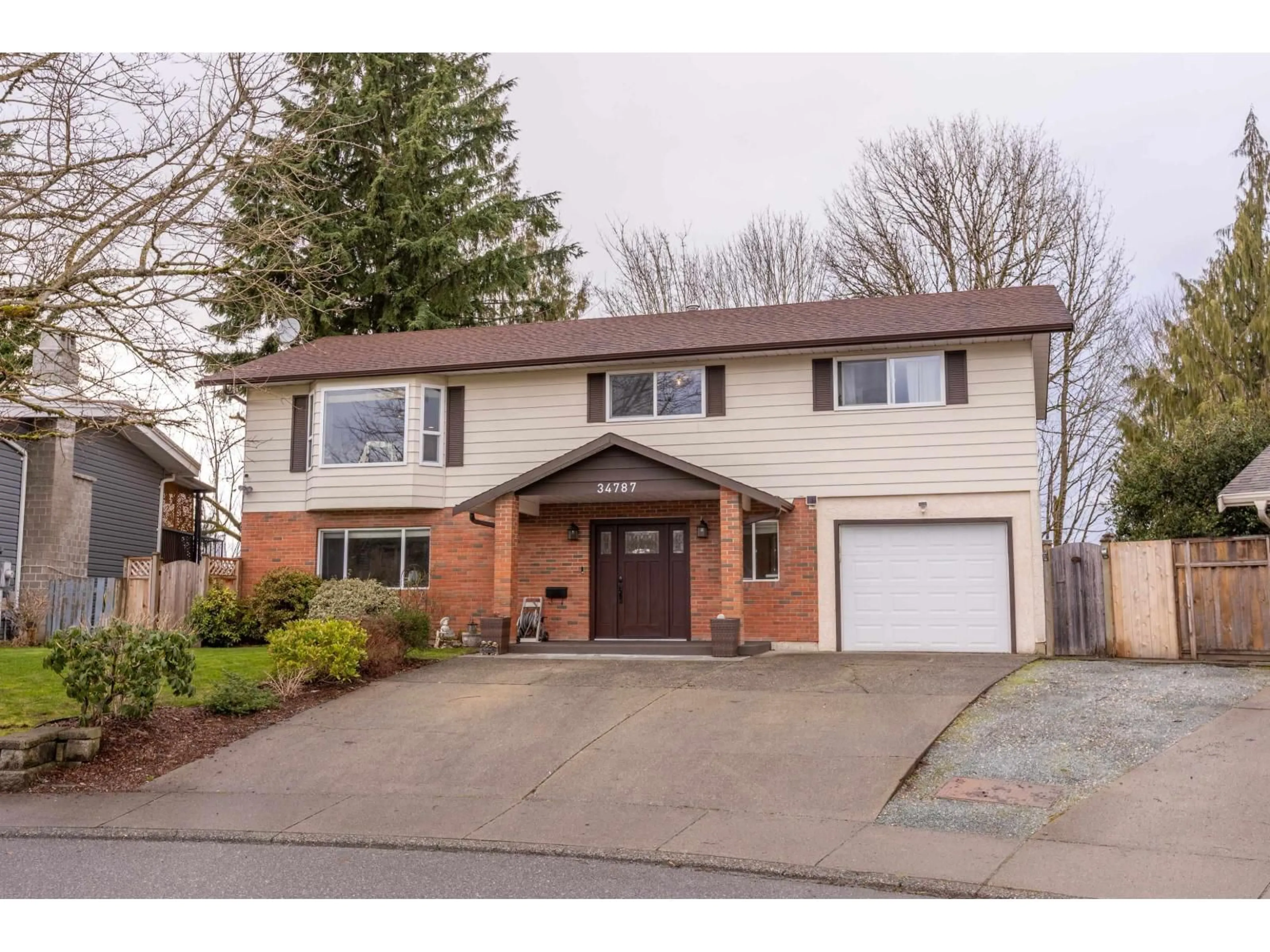 Home with brick exterior material, street for 34787 MIERAU STREET, Abbotsford British Columbia V2S5Y3