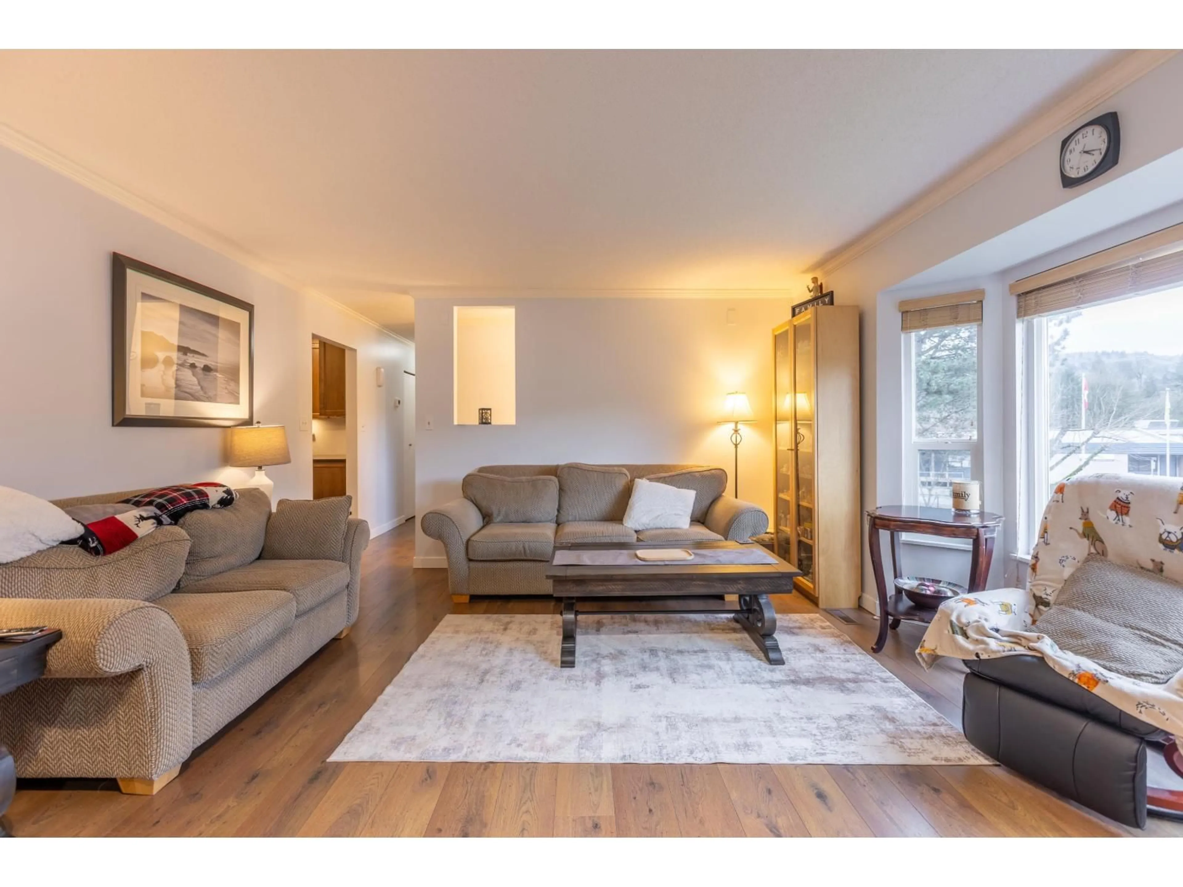 Living room with furniture, wood/laminate floor for 34787 MIERAU STREET, Abbotsford British Columbia V2S5Y3