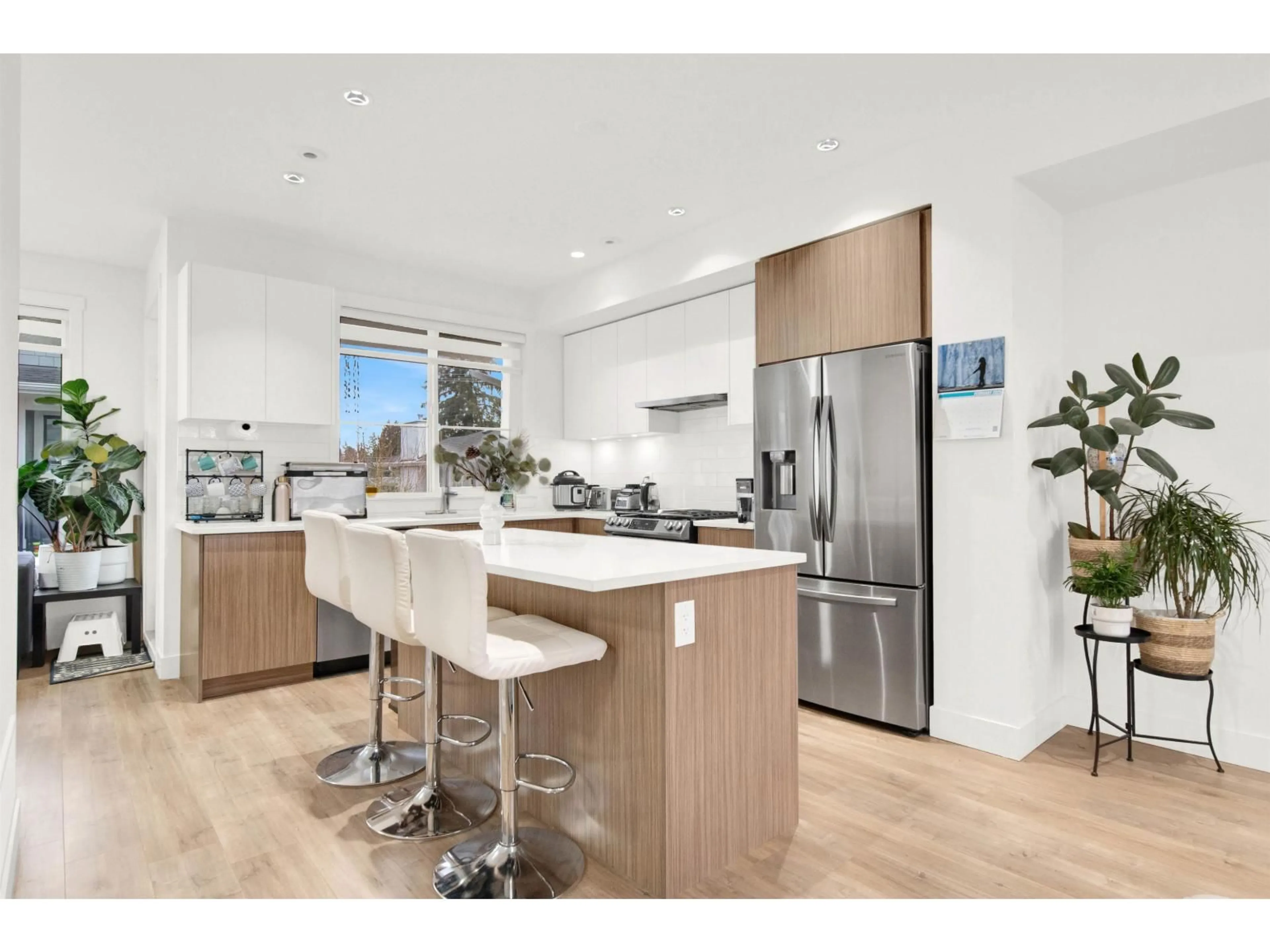 Open concept kitchen, wood/laminate floor for 19 - 11556 72A AVENUE, Delta British Columbia V4C1A9