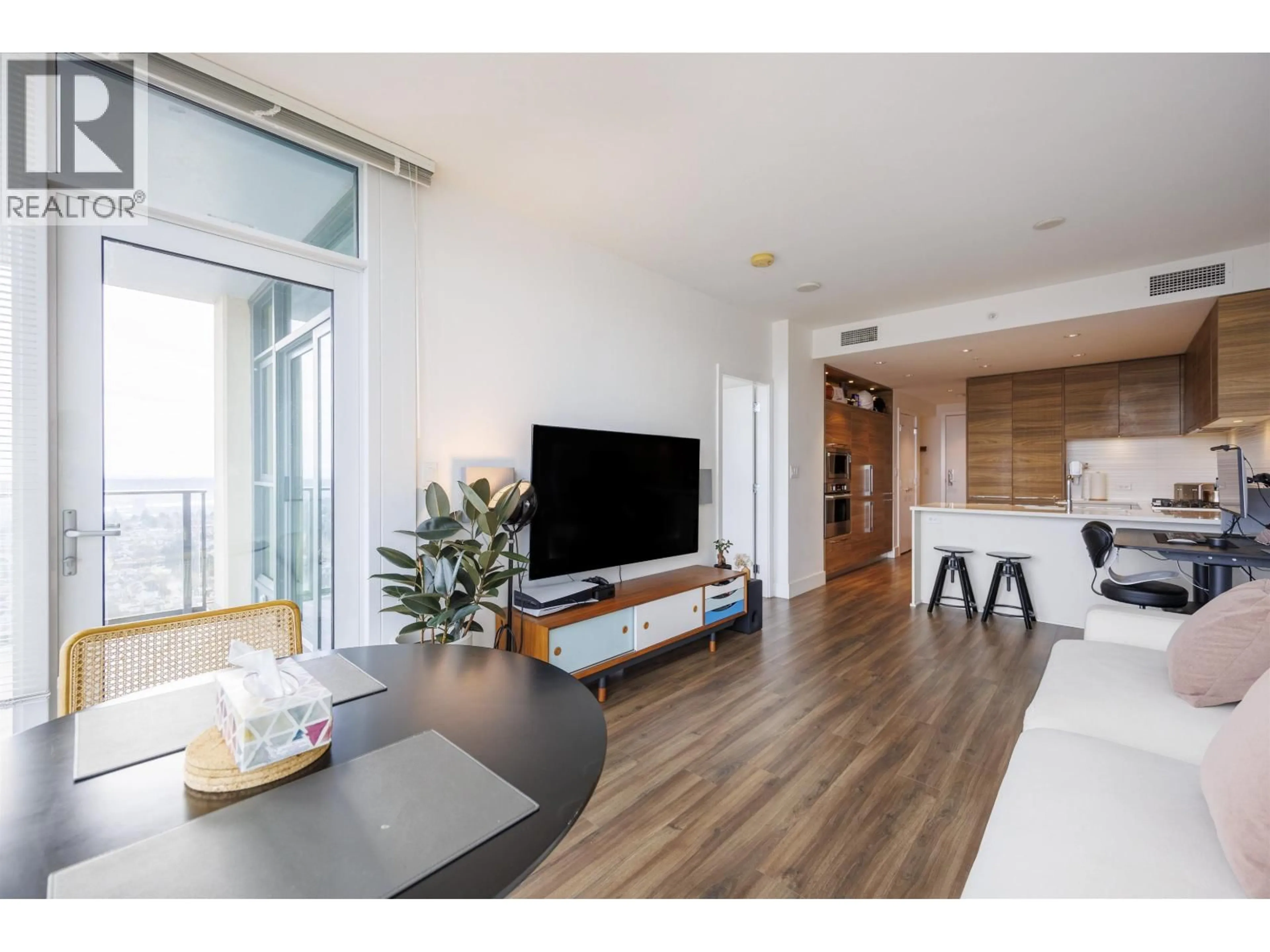 Living room with furniture, wood/laminate floor for 2506 - 7303 NOBLE LANE, Burnaby British Columbia V3N0H2