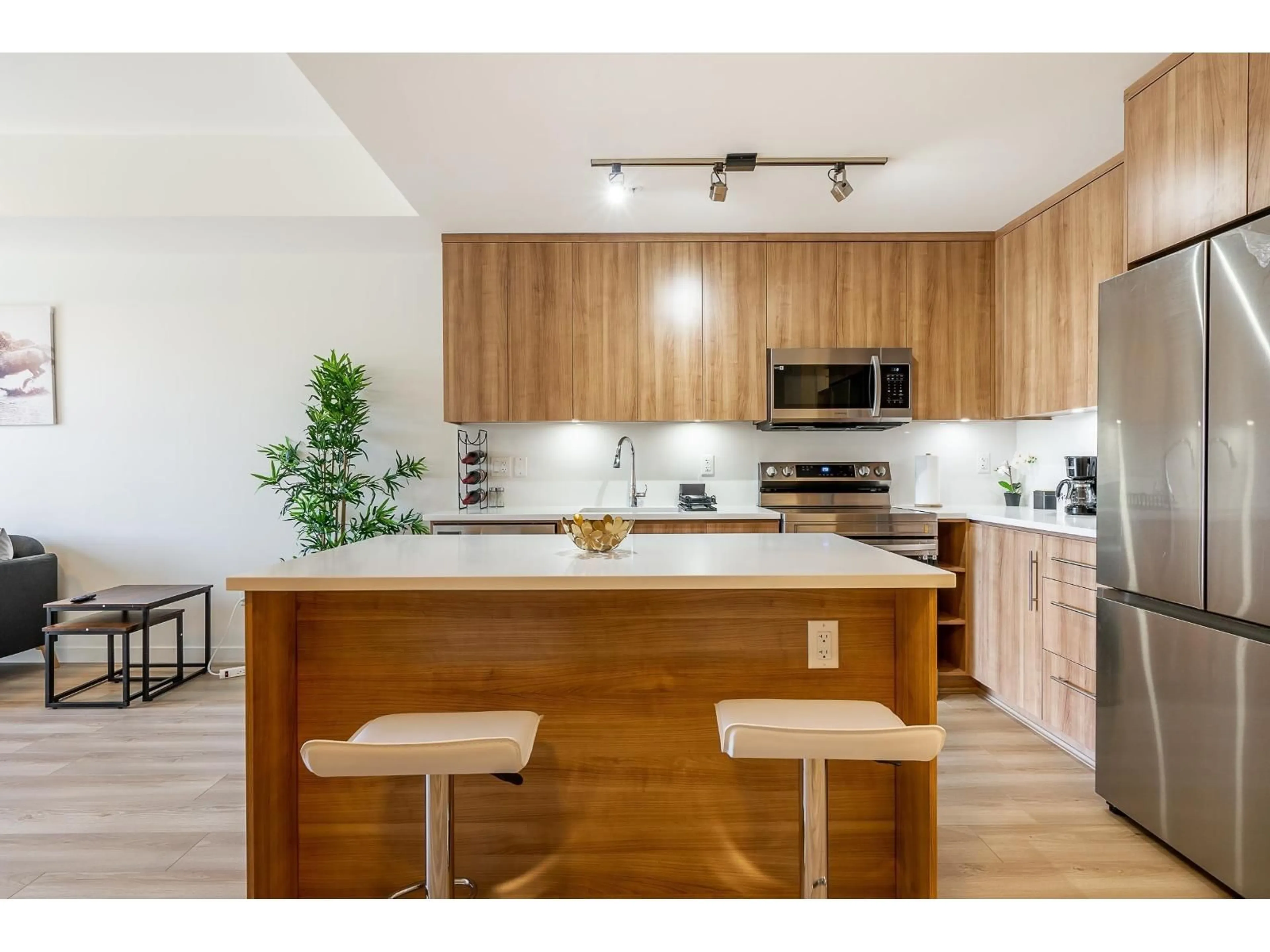 Open concept kitchen, wood/laminate floor for 305 - 5420 208 STREET, Langley British Columbia V3A2J9