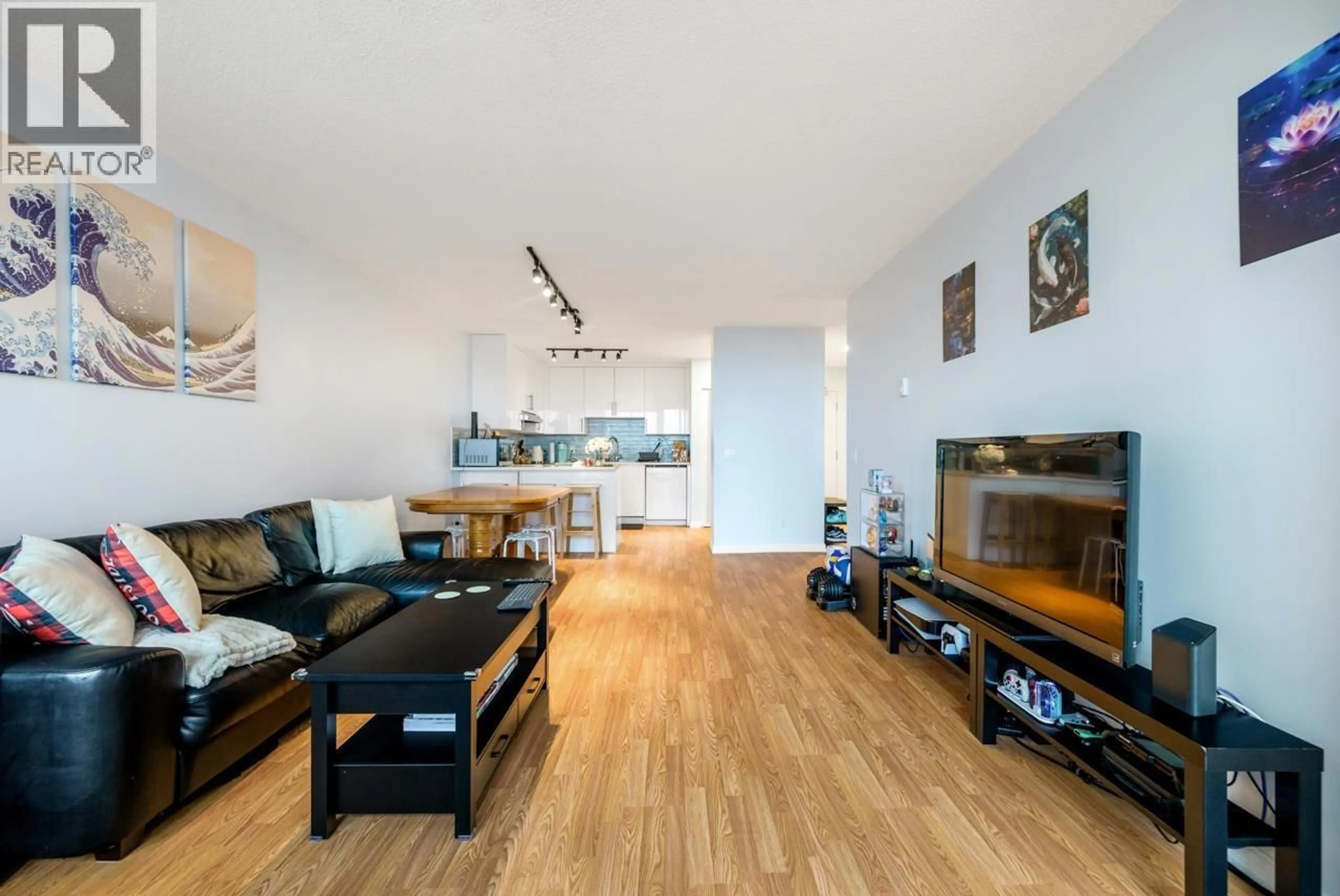 Living room with furniture, wood/laminate floor for 1205 - 3970 CARRIGAN COURT, Burnaby British Columbia V3N4S5