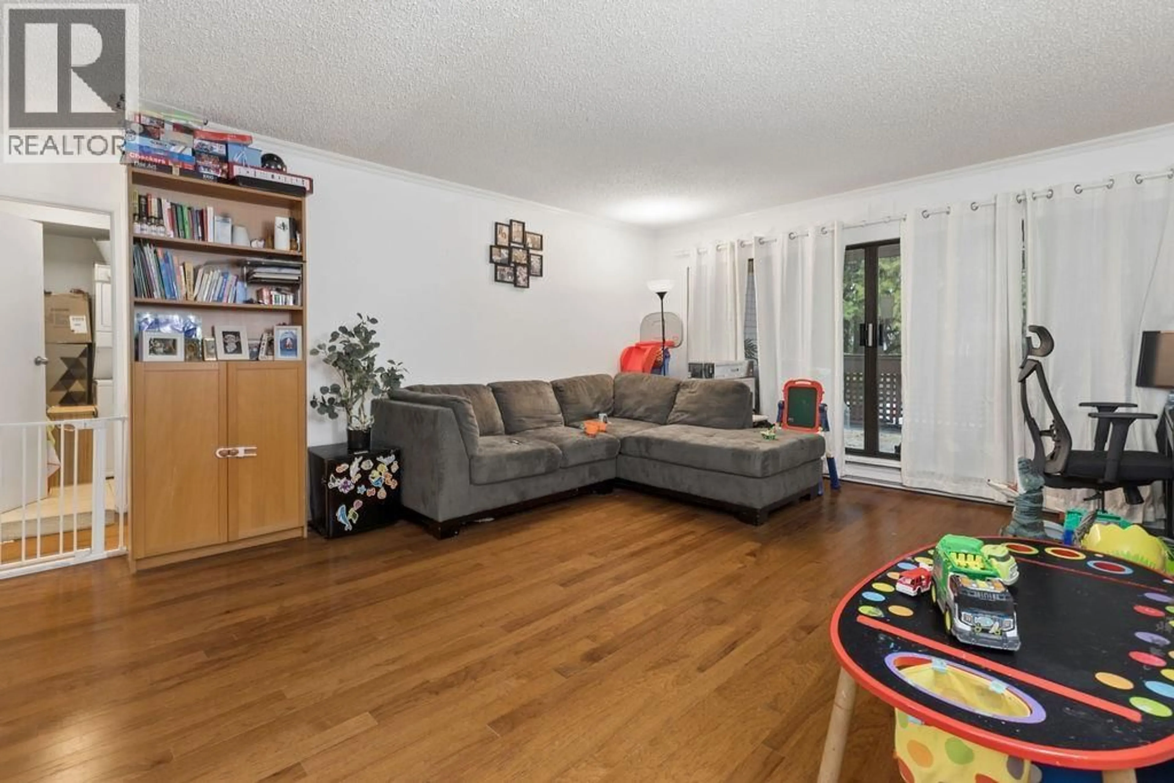 Living room with furniture, wood/laminate floor for 211 - 444 49TH AVENUE, Vancouver British Columbia V5Y3V4